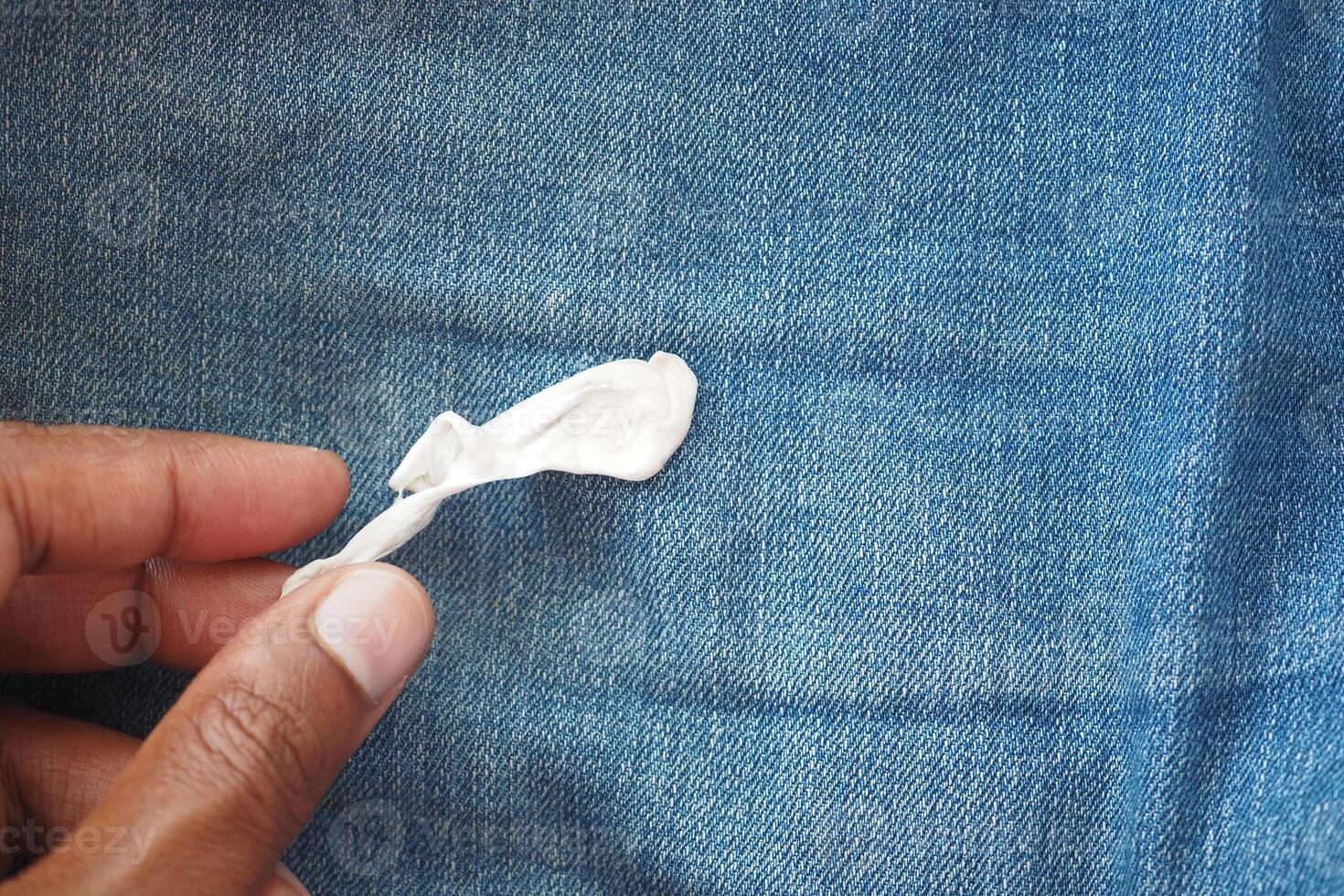 Detailed instructions for effectively removing chewing gum from fabric, with closeup view focus photo