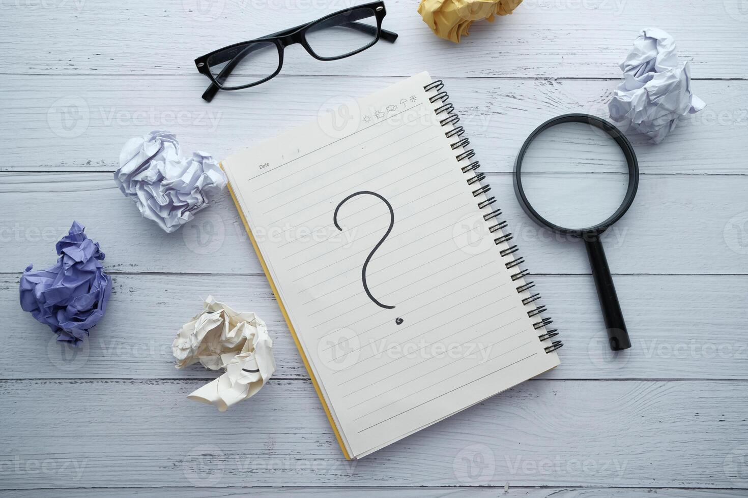 Engaging in the Exploration of Ideas Curiosity Illustrated through a Notebook and a Question Mark photo