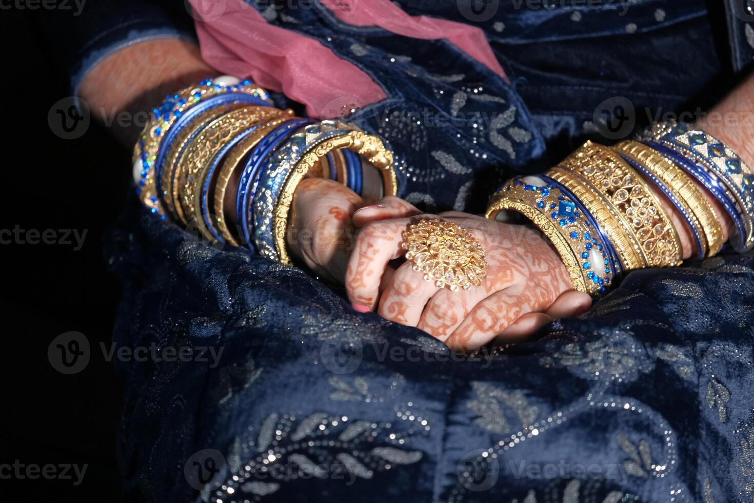 Elegant hands adorned with colorful bangles and intricate mehndi showcase artistry and beauty photo
