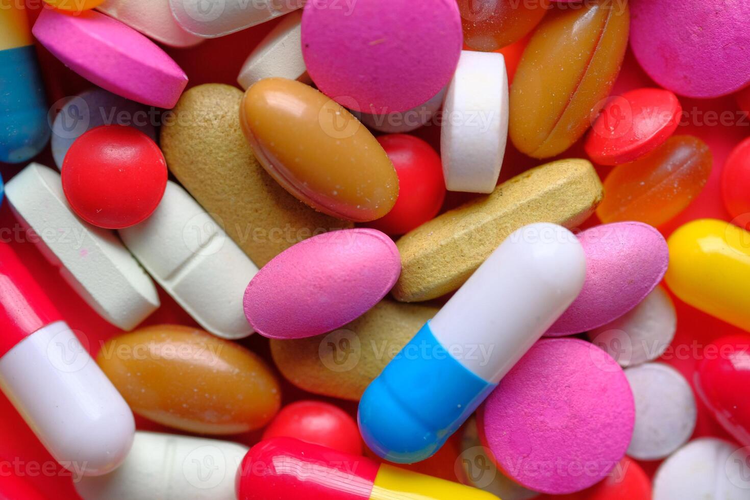 A Wide Variety of Colorful Pills and Tablets Featuring a Bright and Vibrant Background photo