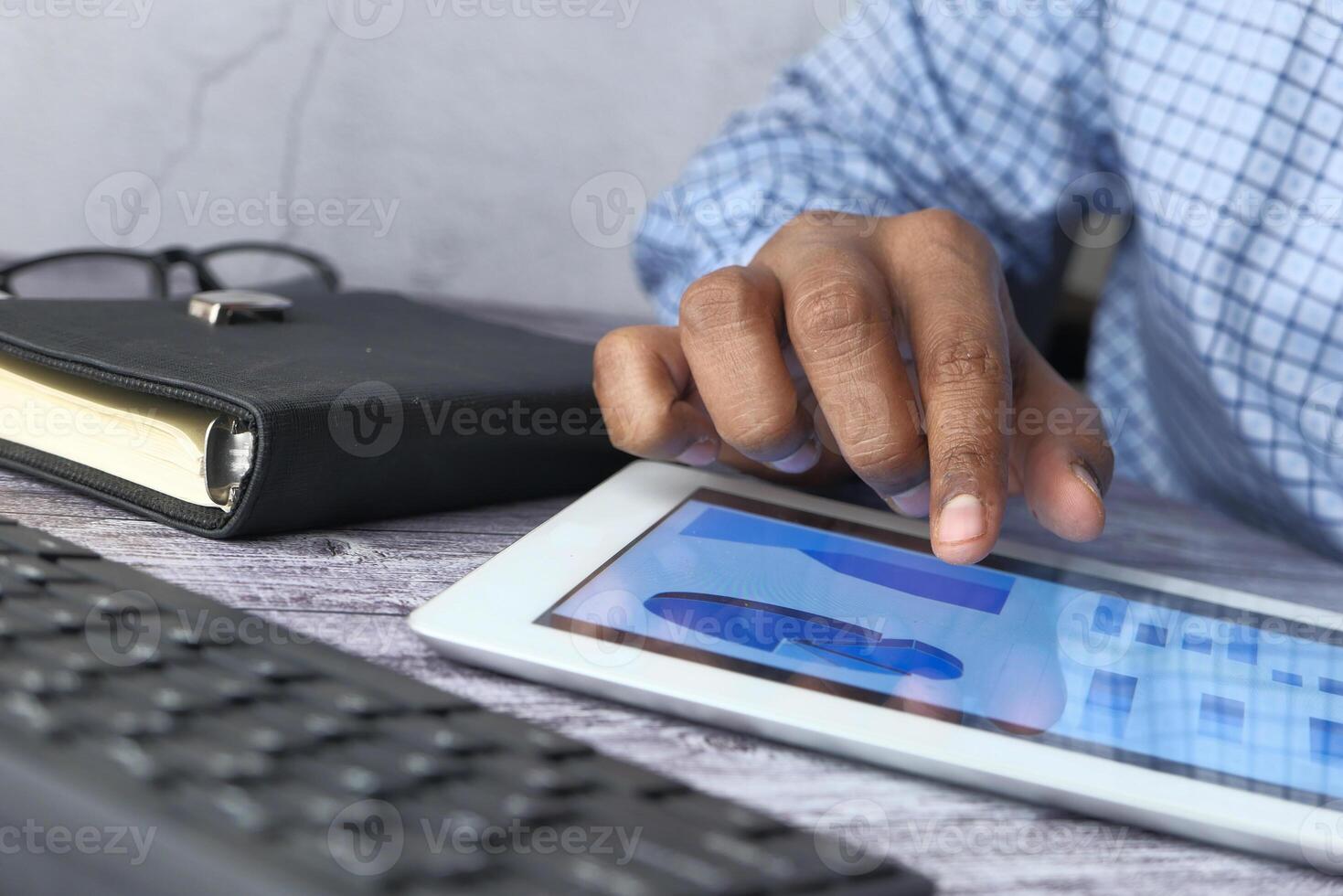 A Business Professional Engaging with a Tablet for Effective Digital Communication and Planning photo