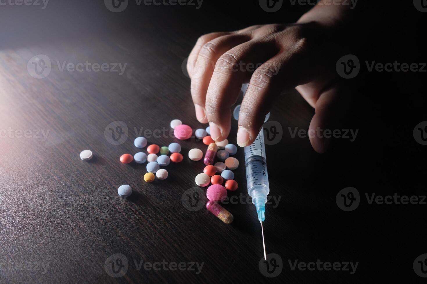 The use of intravenous drugs, combined with different types of pills and syringes, photo