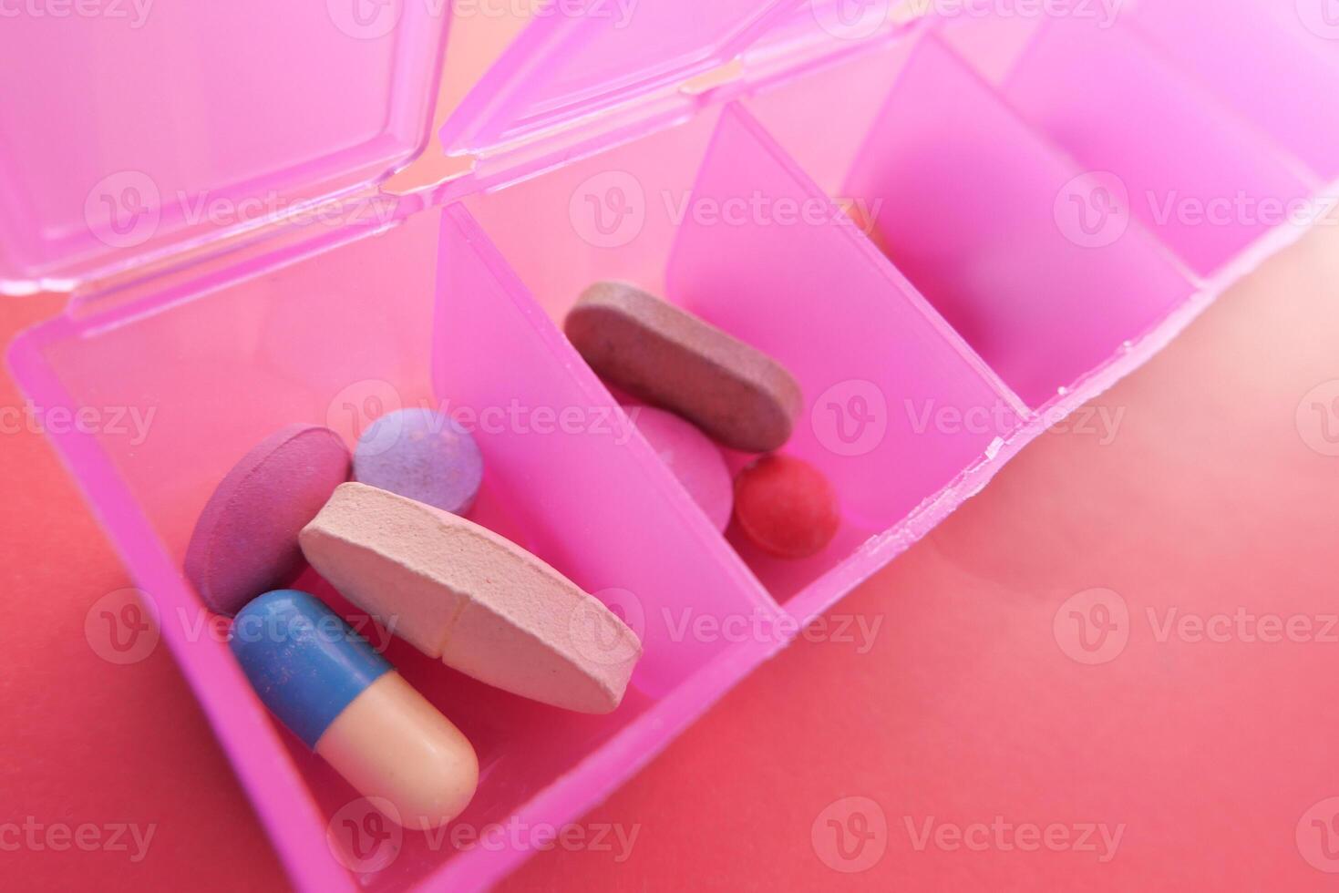 A Bright and Colorful Pill Organizer Featuring an Array of Different Medications and Supplements photo