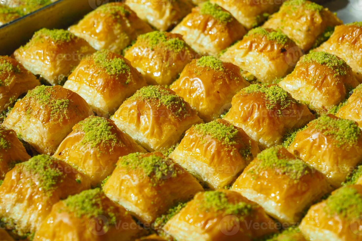 Enjoy the mouthwatering and delicious Baklava Slices that come with a delightful Pistachio Topping photo