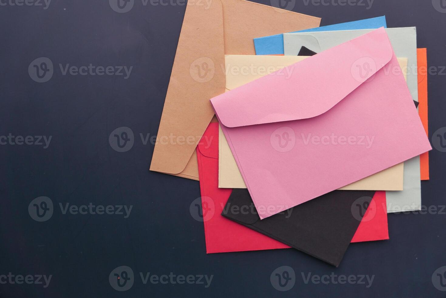 A Beautiful Arrangement of Colorful Envelopes Set Against a Dark Background for Impact photo