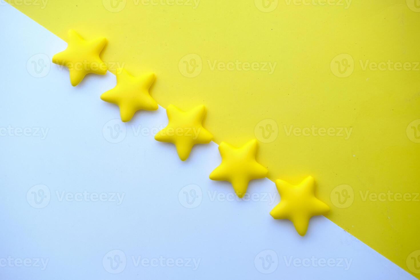 Vibrant and Colorful Yellow Star Shapes Displayed on a Bright and Cheerful Background photo