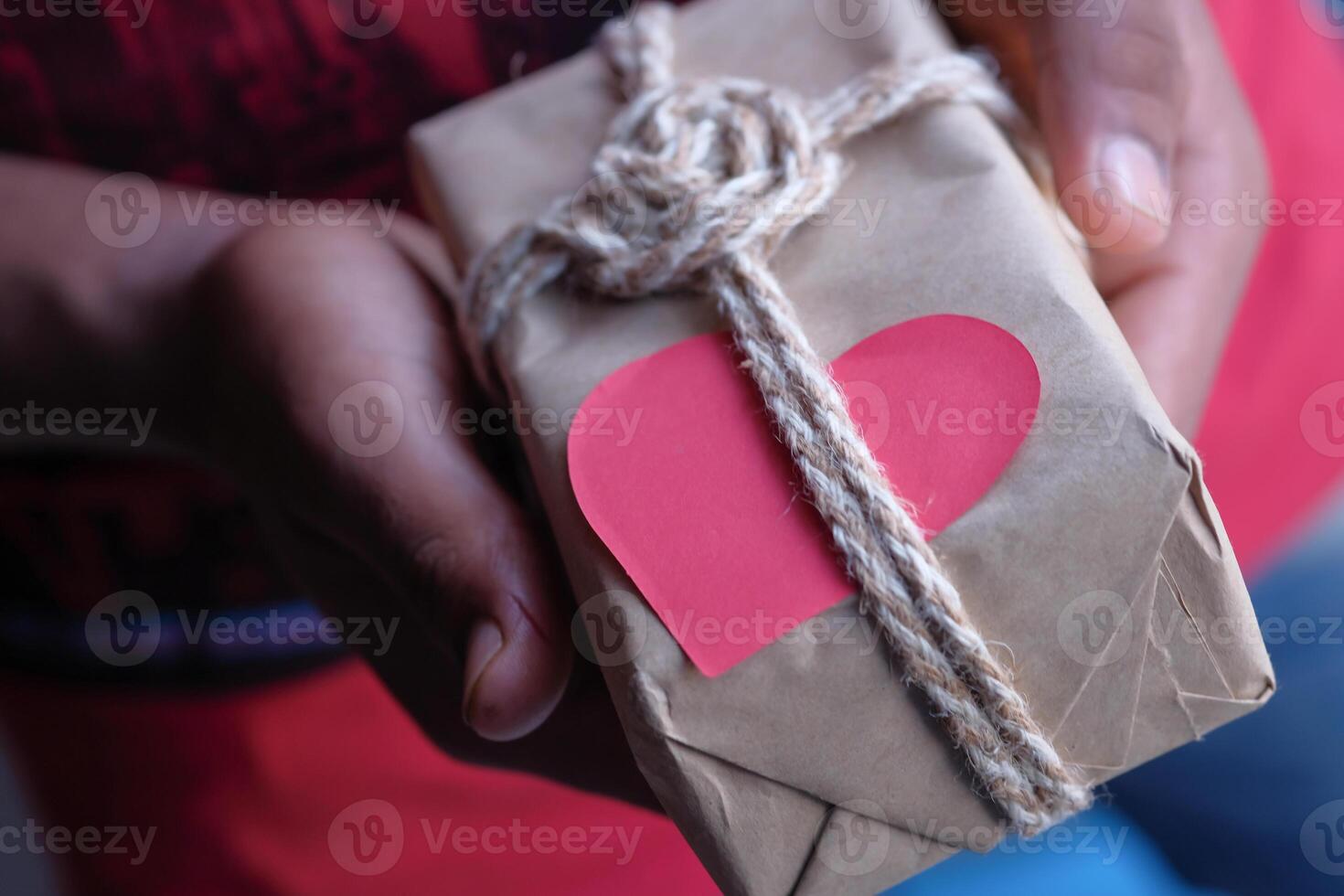 This handcrafted gift is wrapped with love, featuring a string and heart tag attached photo