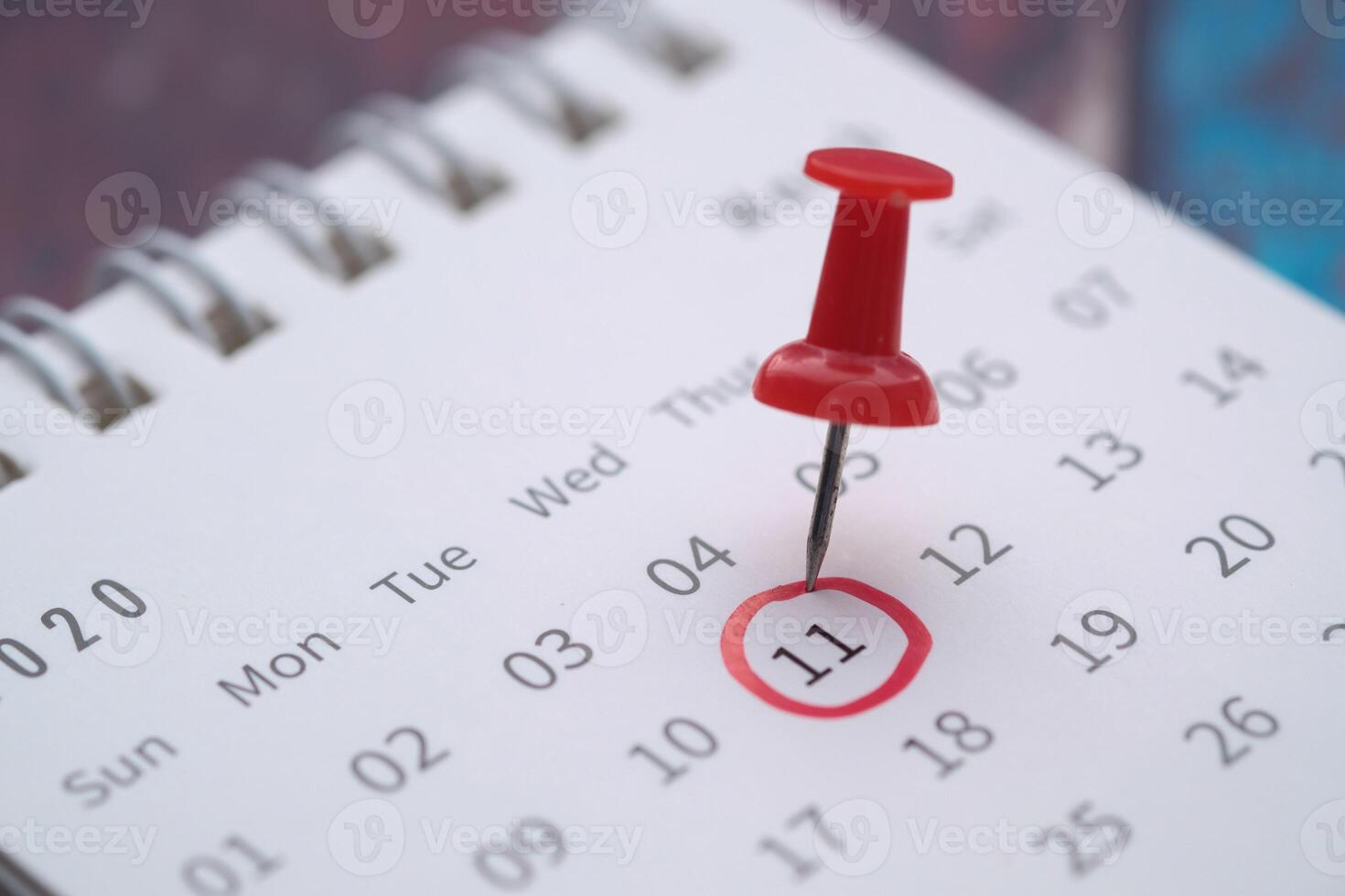 Highlighted Calendar Date with a Red Push Pin for Important Reminders and Events photo