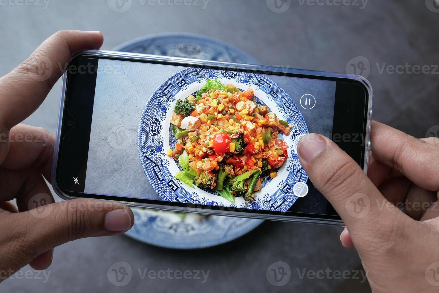 Capturing a Vibrant and Colorful Dish with a Smartphone for Sharing and Enjoyment photo