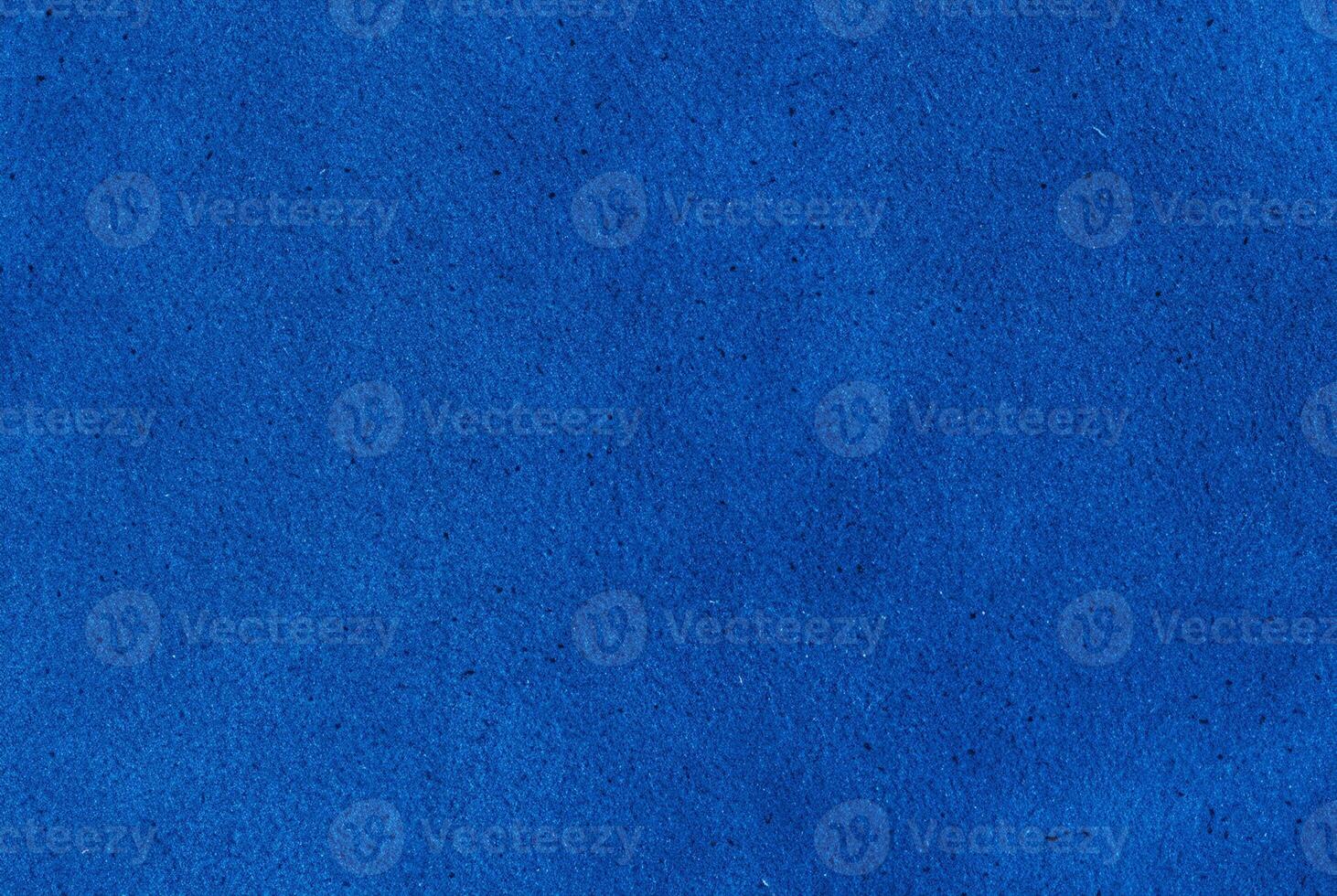 Bright blue textured surface, ideal as a background or design element for creative and decorative projects. photo