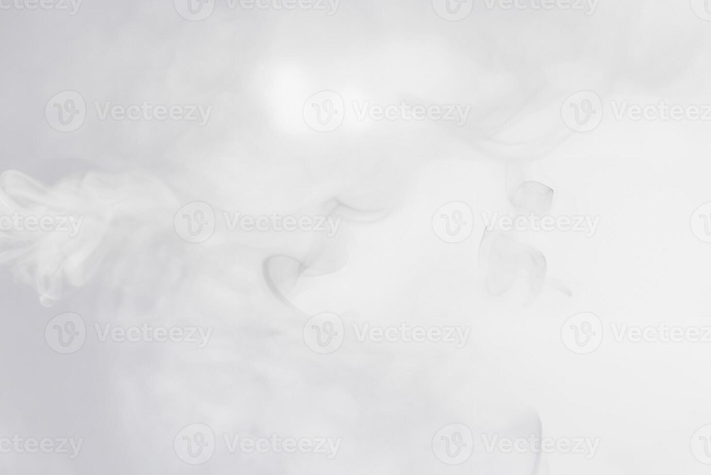 Soft white smoke or mist floating on a light background, perfect for abstract, atmospheric, or ethereal designs. photo