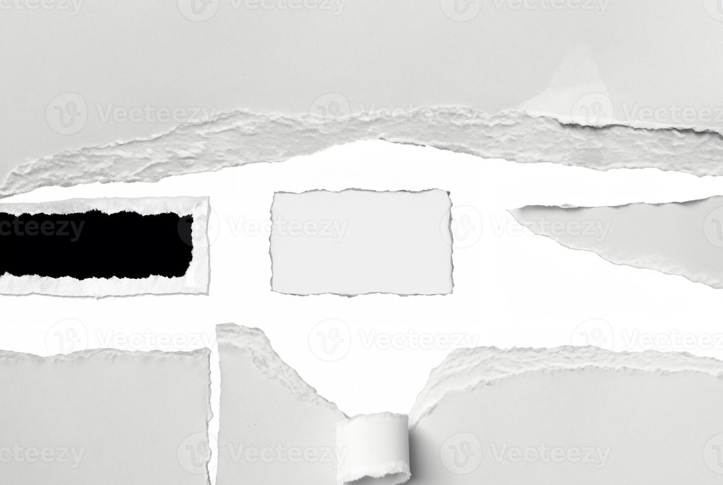 A close-up of torn paper with rough ripped edges, creating a blank white space in the center. Ideal for text insertion or creative design projects. photo