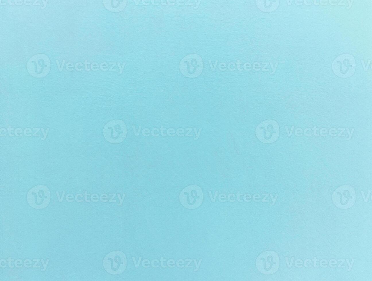 Minimalist light blue textured background with a subtle grain, ideal for design projects or as a backdrop. photo