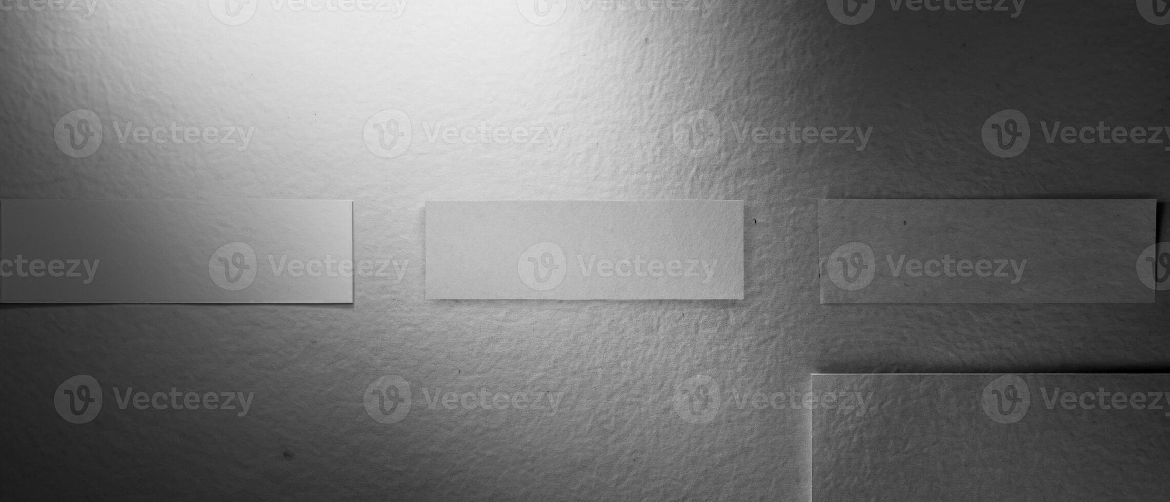 Grayscale smooth paper texture with a subtle shadow gradient, ideal for backgrounds or designs. photo