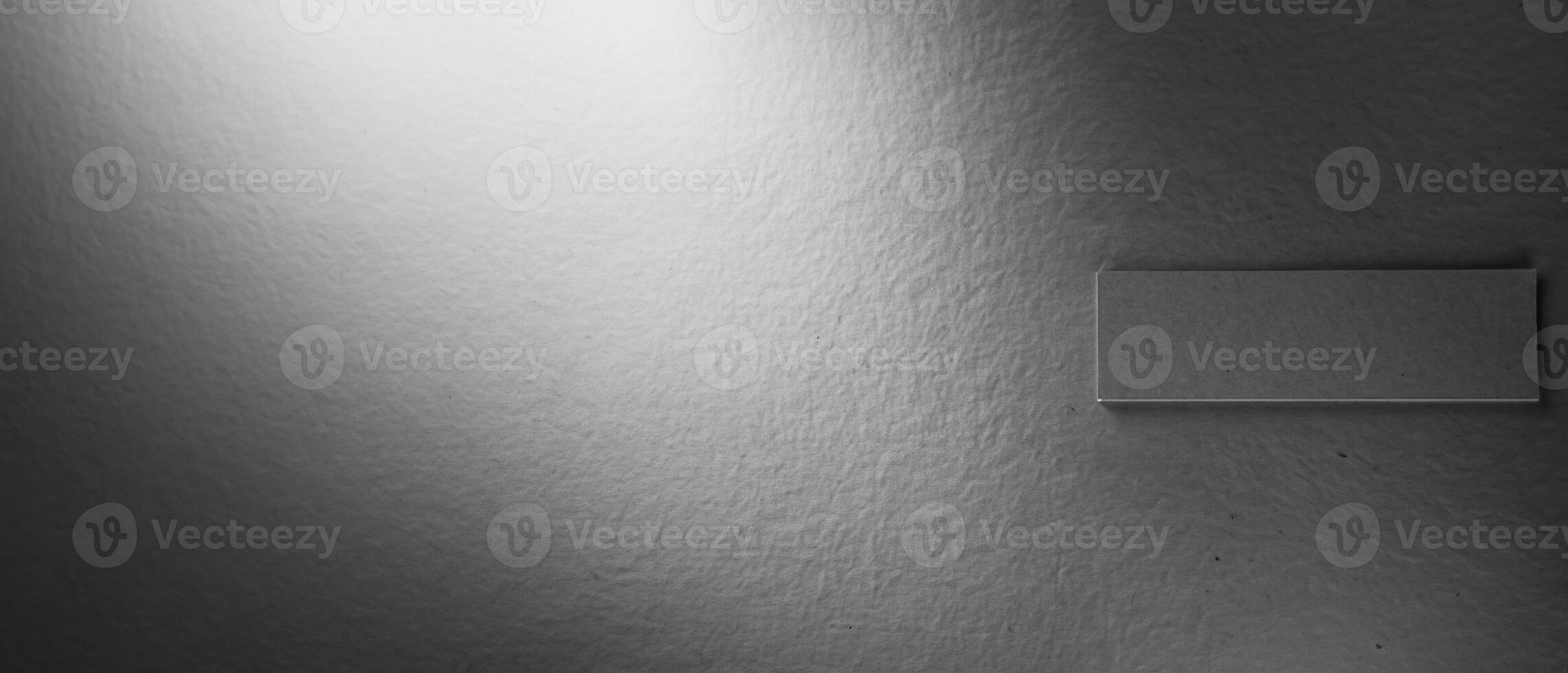 Grayscale smooth paper texture with a subtle shadow gradient, ideal for backgrounds or designs. photo