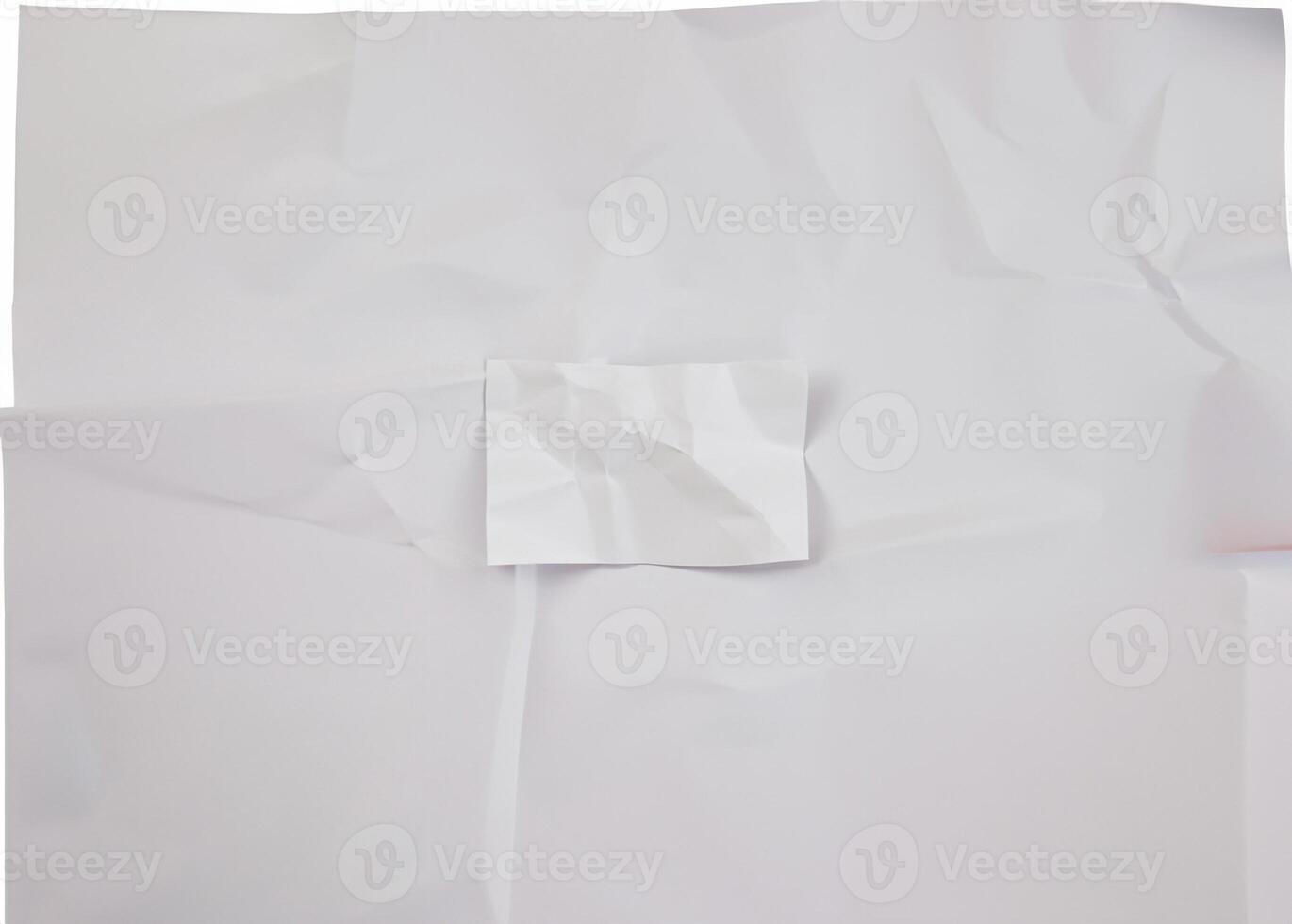A crumpled white paper sheet with visible wrinkles and folds, isolated on a plain white background. photo