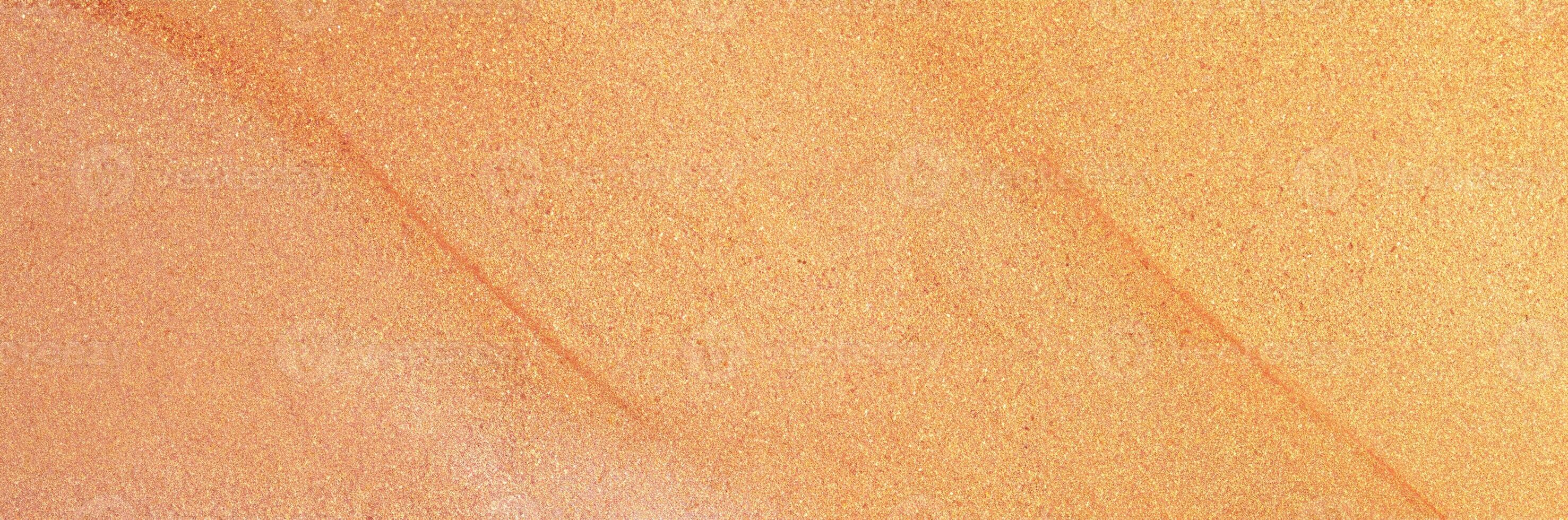 Abstract peach and gold shimmering texture background, ideal for festive designs and creative projects. photo