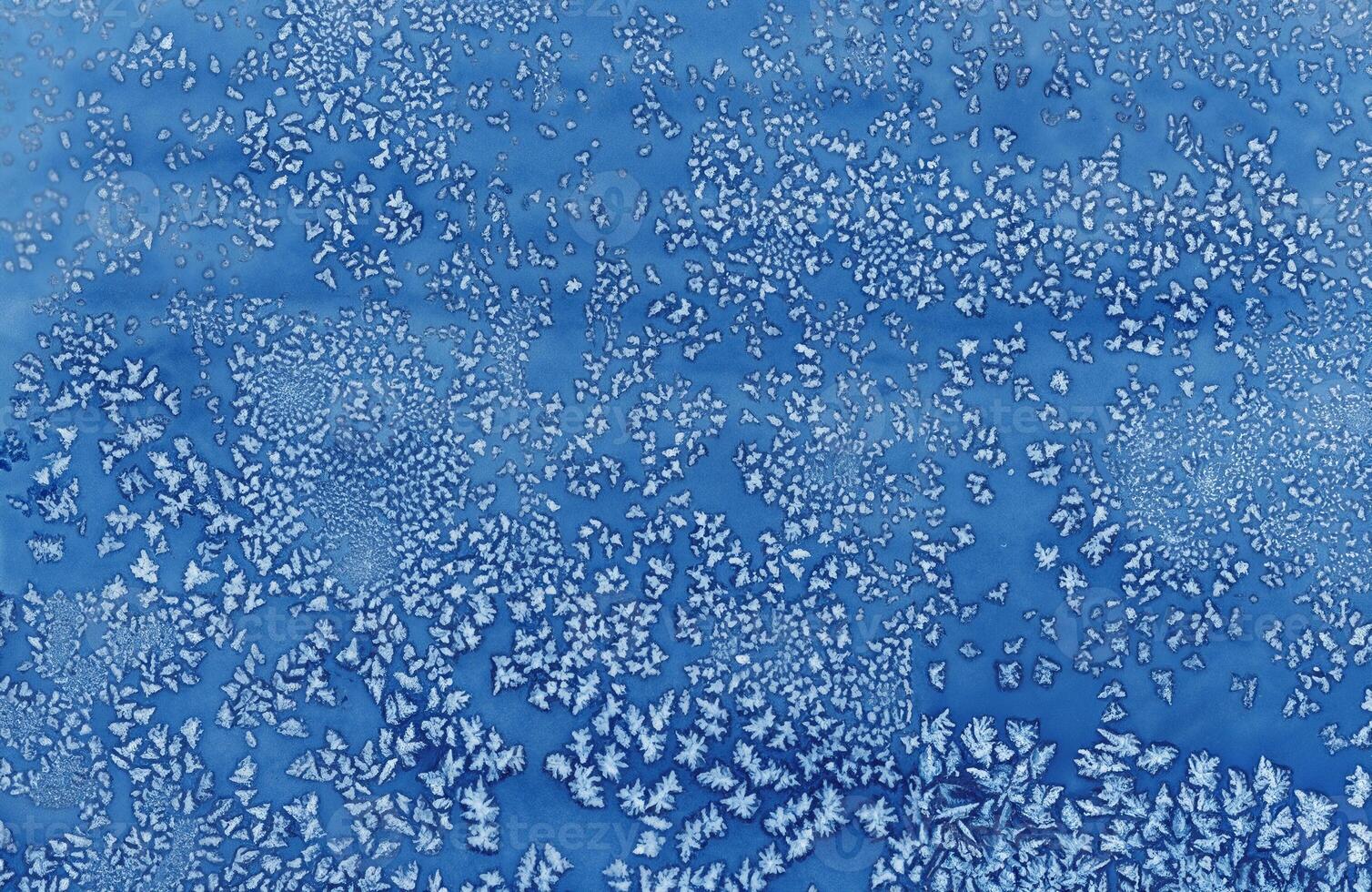 Abstract blue frost pattern resembling ice crystals, perfect for winter-themed designs, backgrounds, and creative projects. photo