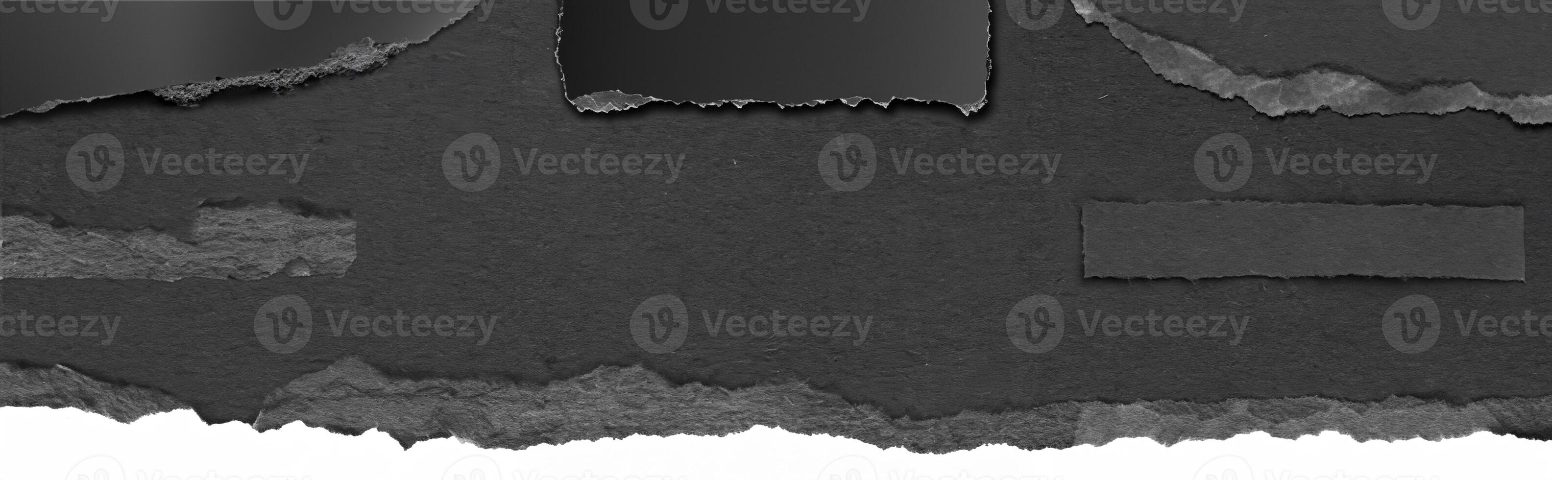 Close-up texture of torn black paper with a rough edge, perfect for background, design, or collage elements. photo