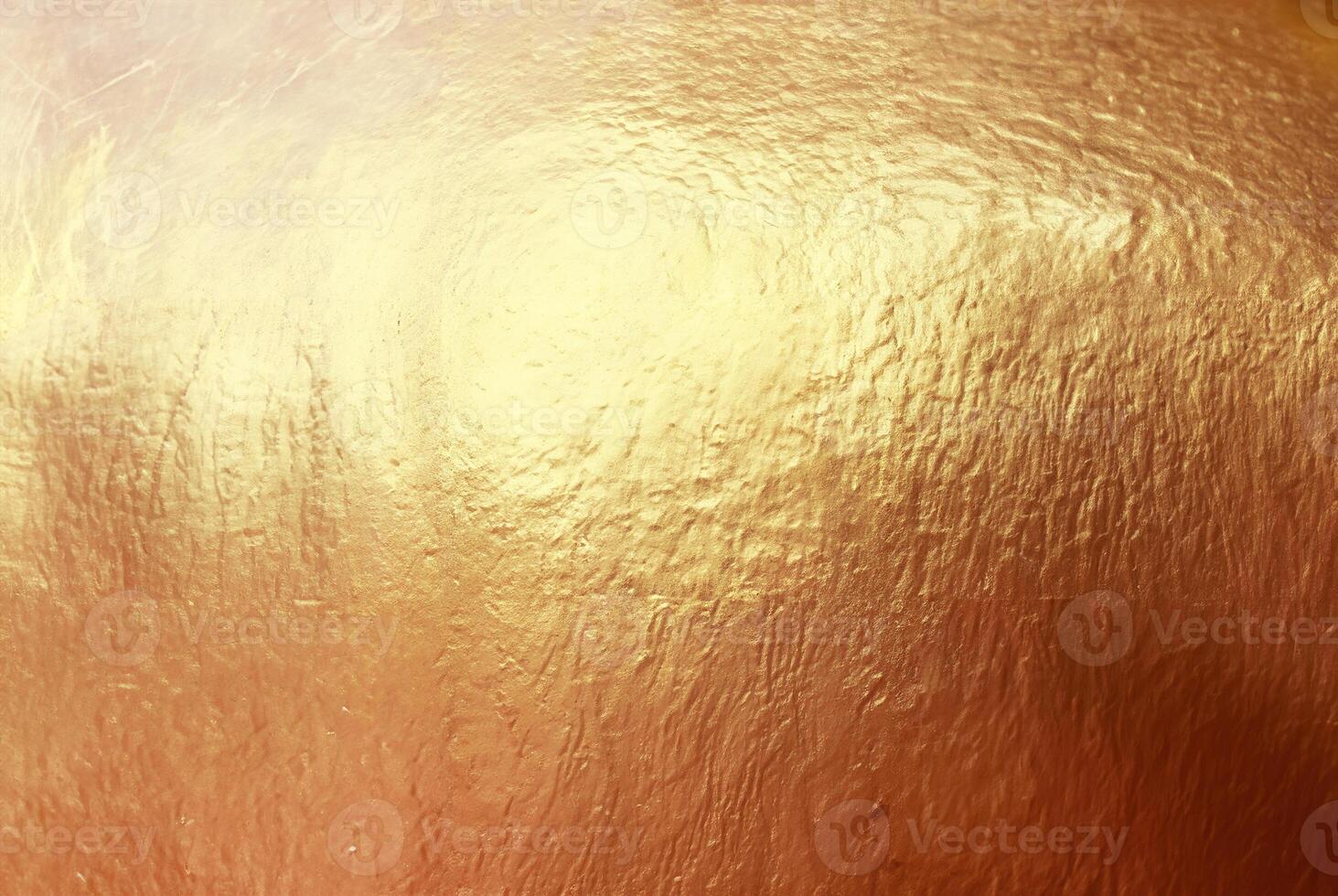 Close-up of textured gold surface with a metallic shine, ideal for use in luxury backgrounds, design, and creative projects. photo