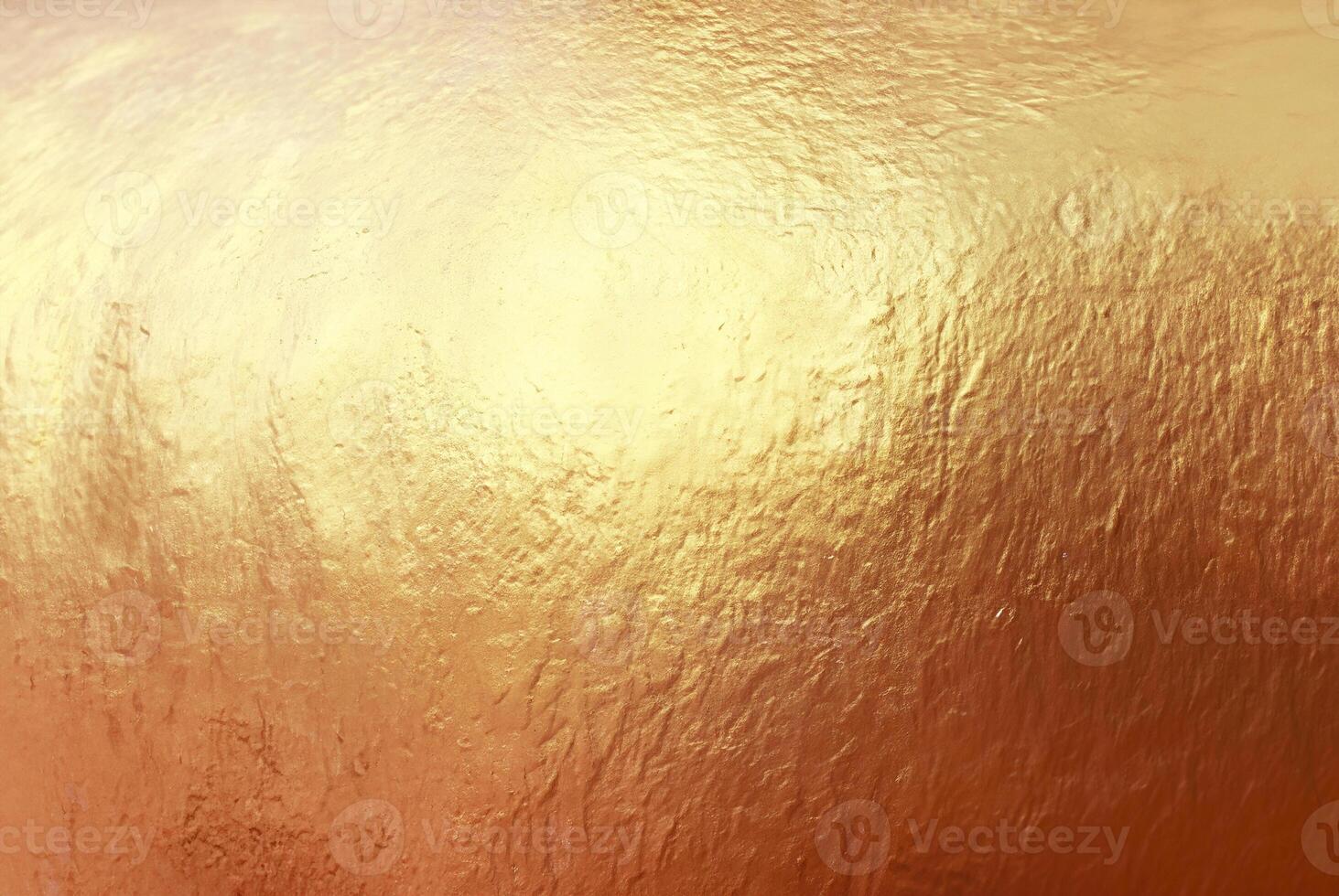 Close-up of textured gold surface with a metallic shine, ideal for use in luxury backgrounds, design, and creative projects. photo