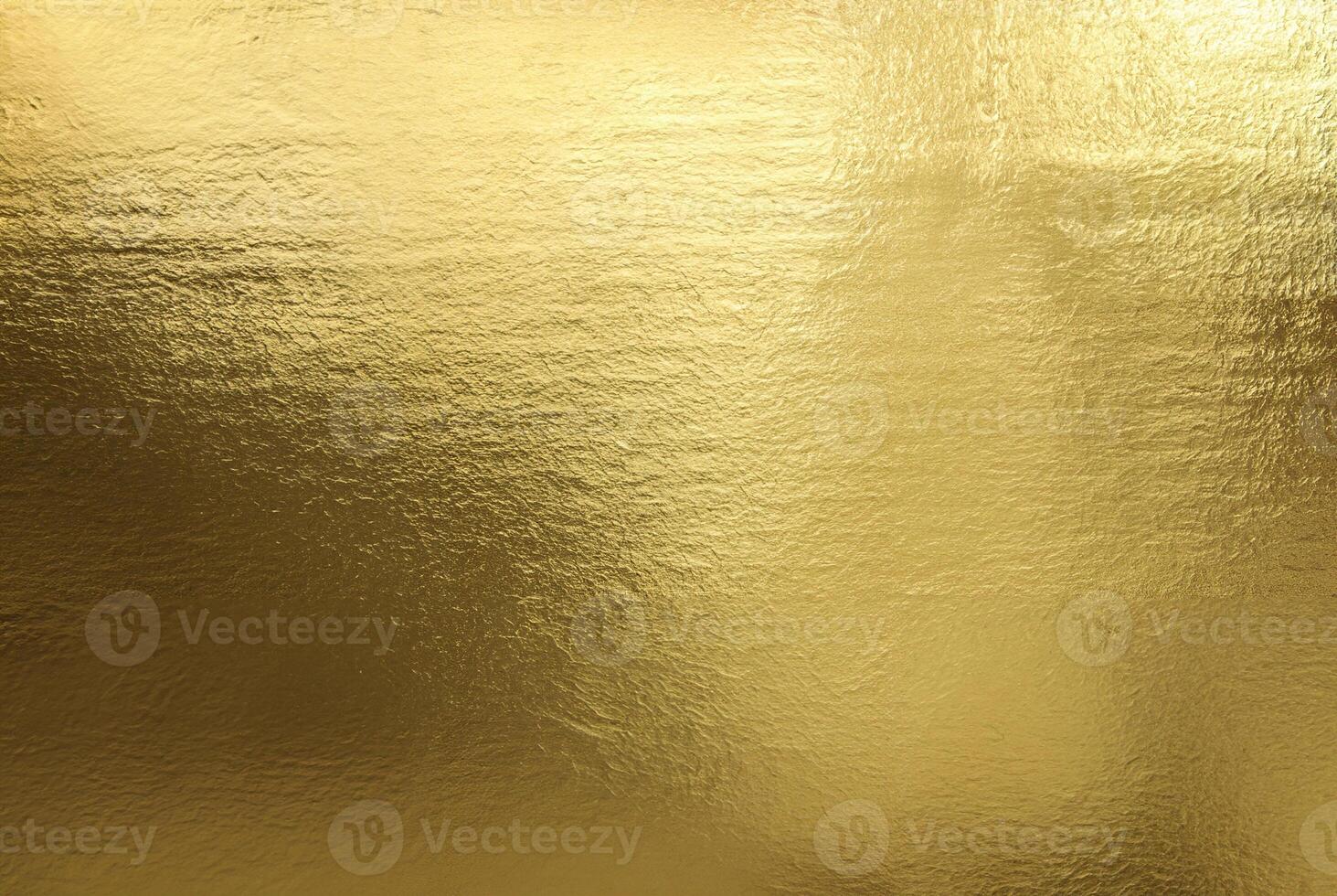 Shiny gold foil texture with a smooth, reflective surface ideal for backgrounds or luxurious designs. photo