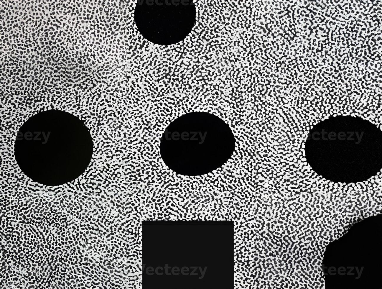 Abstract black and white dotted texture forming a random yet organized pattern with intricate details. photo