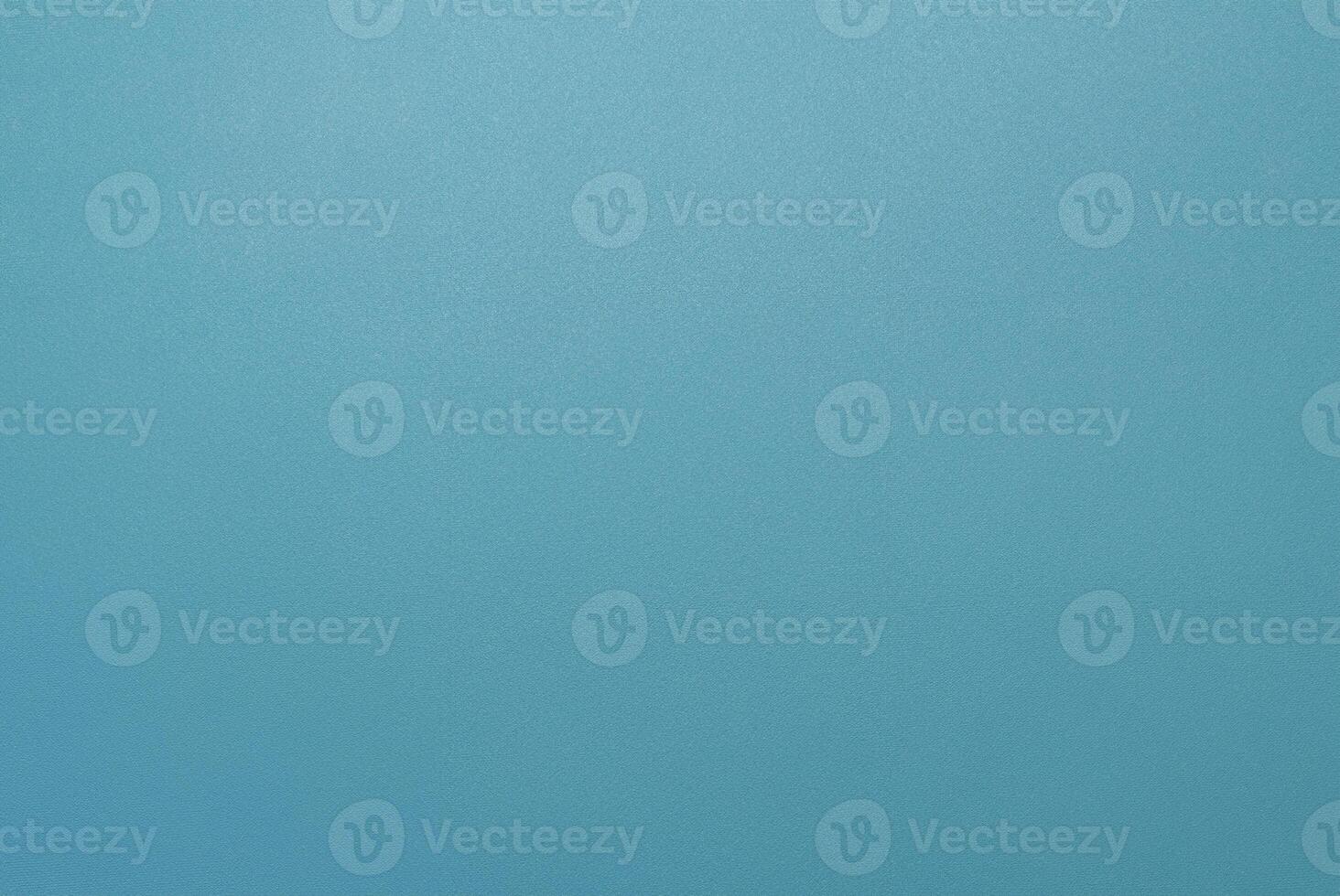 Simple minimalist blue textured background with a smooth surface, perfect for design projects. photo
