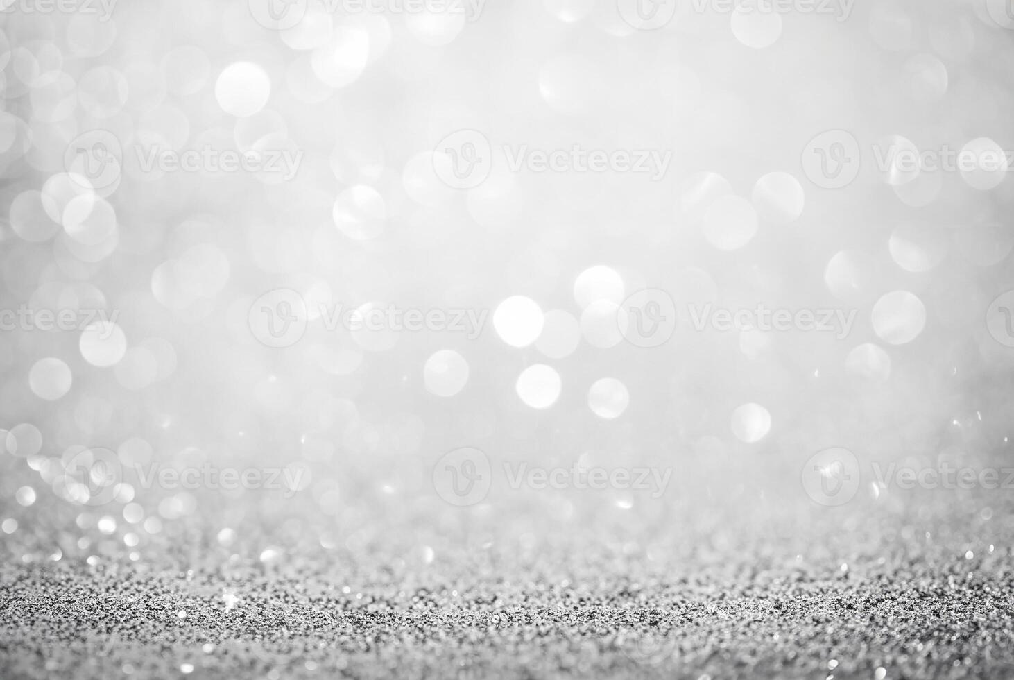 Abstract silver glitter background with defocused bokeh lights, perfect for festive or elegant designs. photo