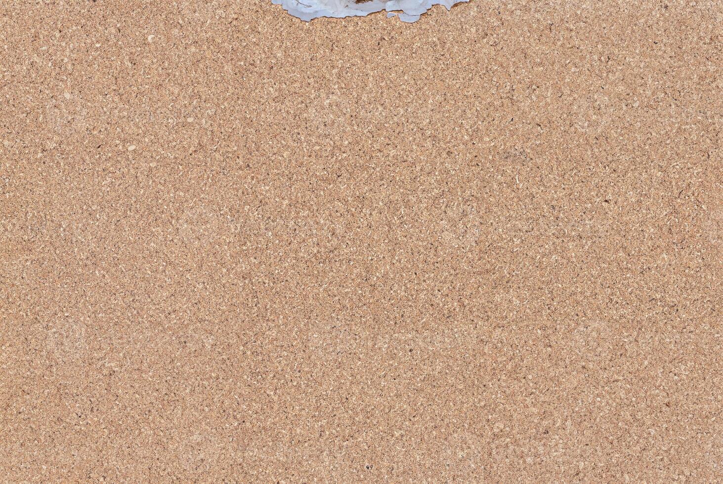 High-resolution cork board texture with a natural brown color, ideal for backgrounds and design projects. photo