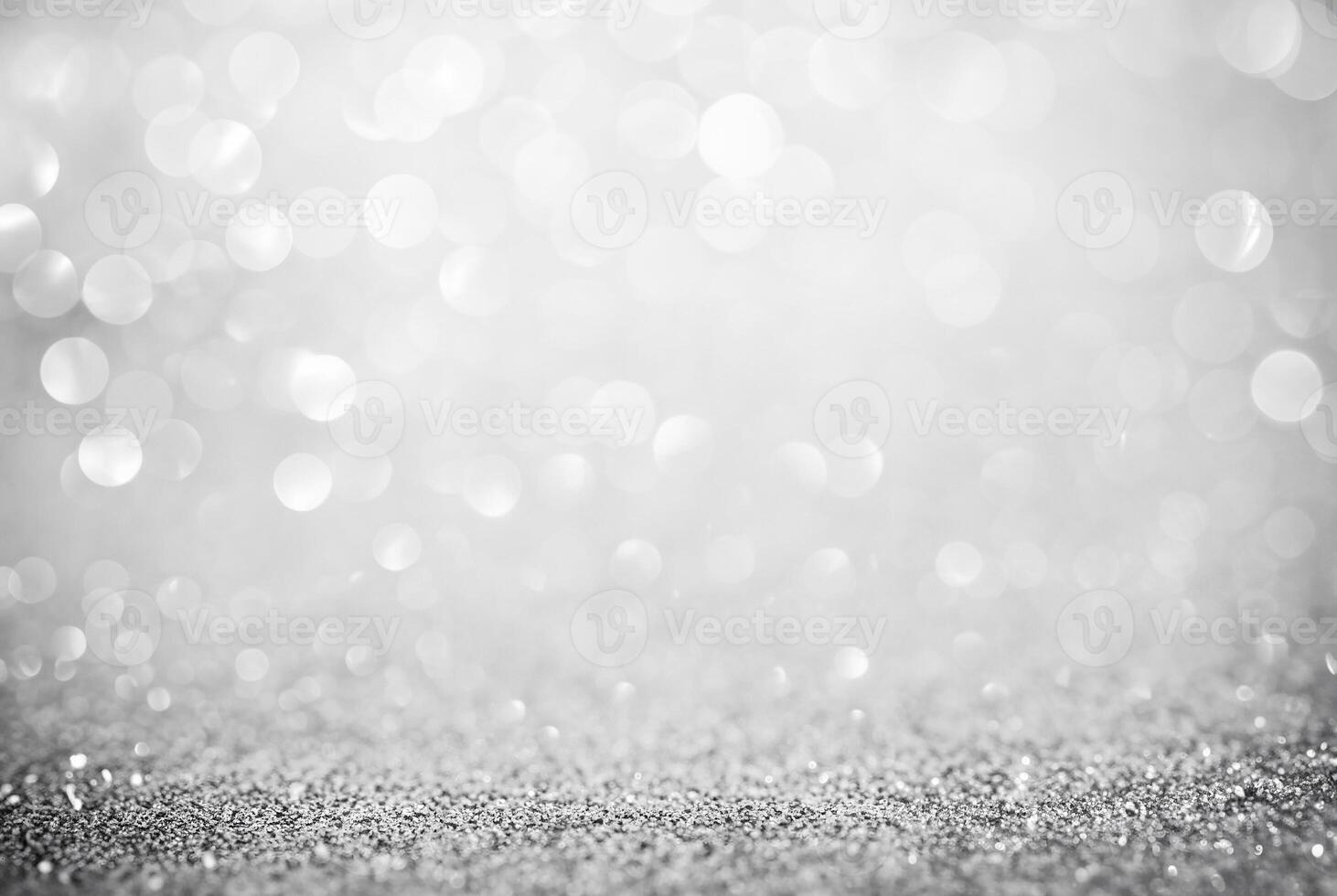 Abstract silver glitter background with defocused bokeh lights, perfect for festive or elegant designs. photo