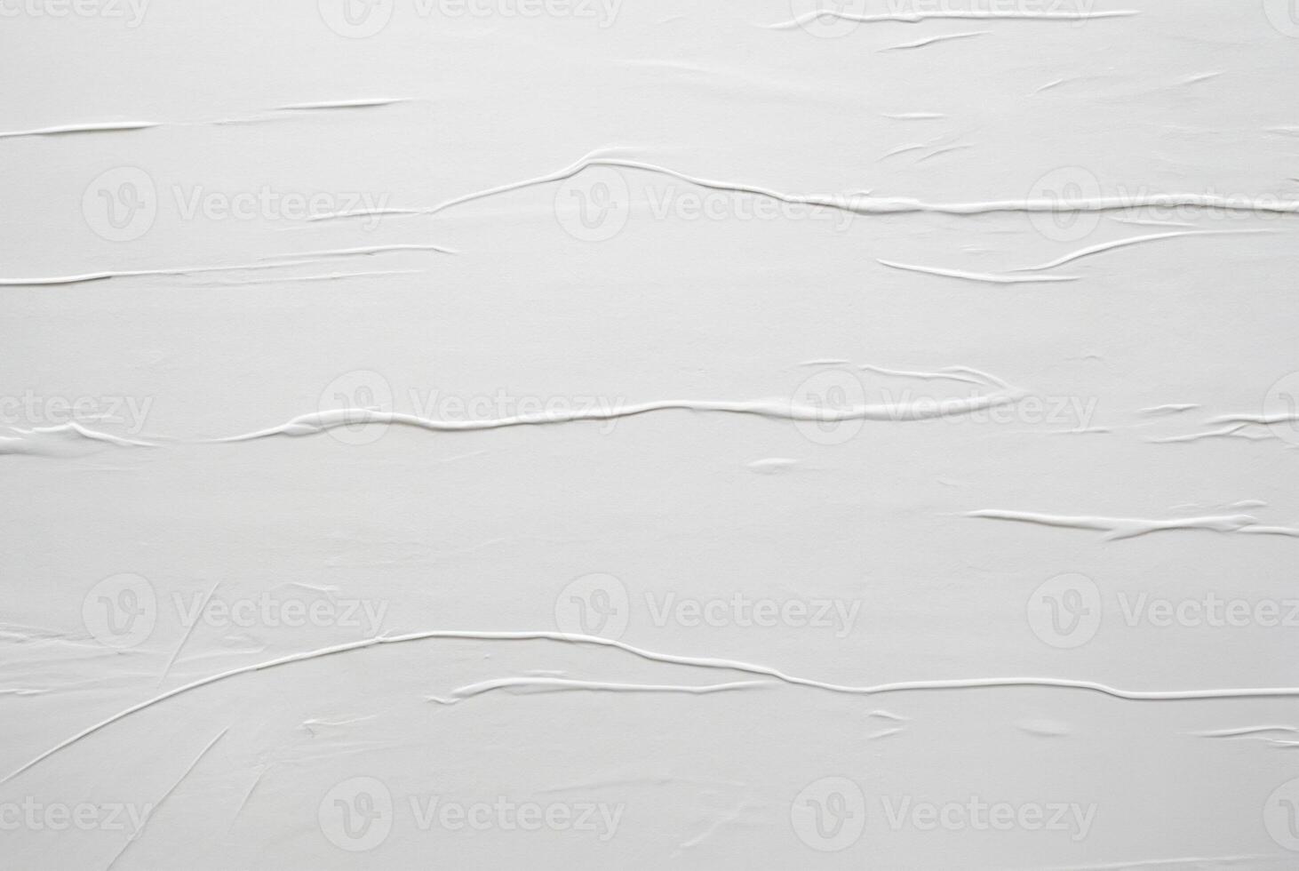 Minimalist white textured surface with soft horizontal lines and creases, ideal for abstract backgrounds, design, or texture use. photo