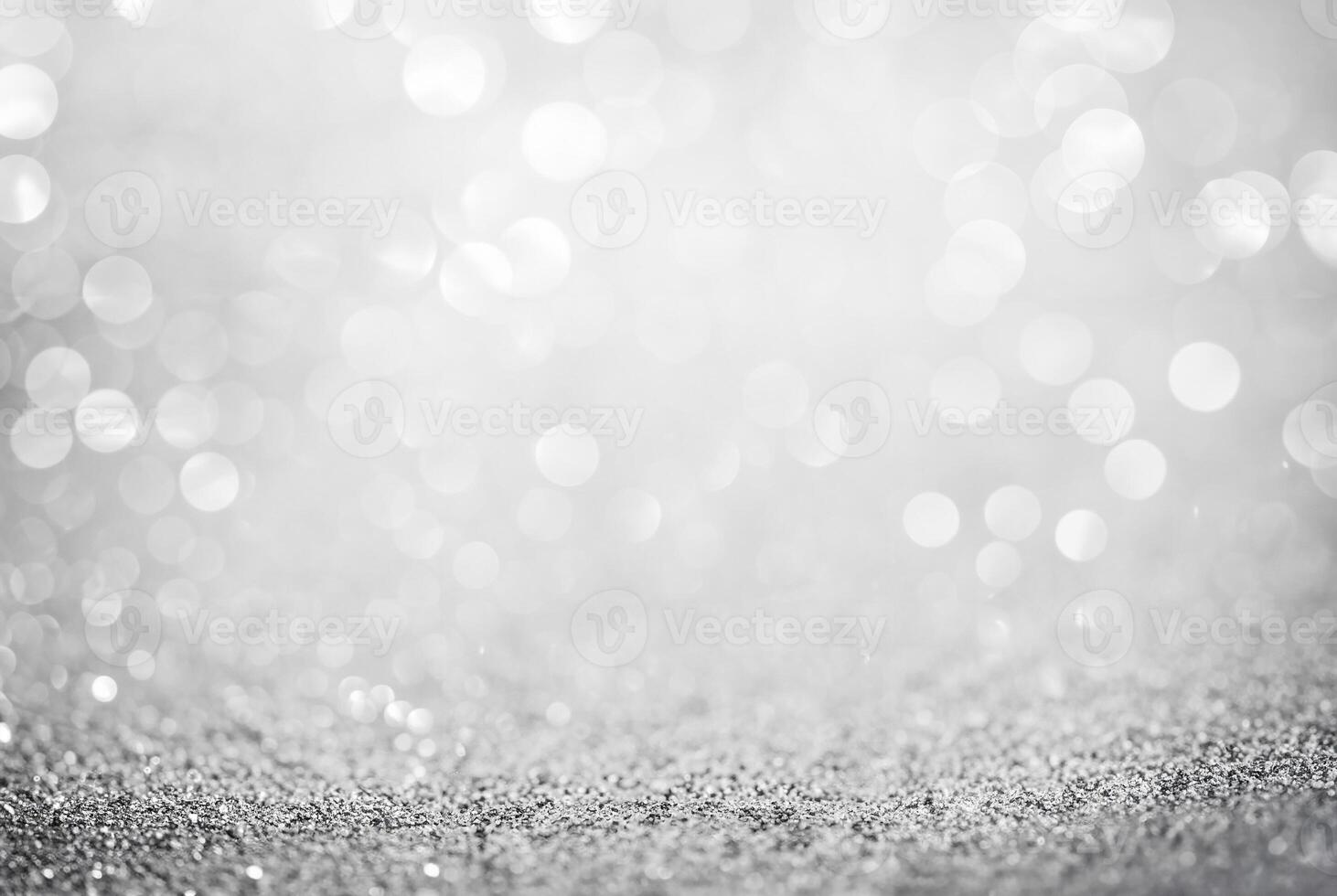 Abstract silver glitter background with defocused bokeh lights, perfect for festive or elegant designs. photo