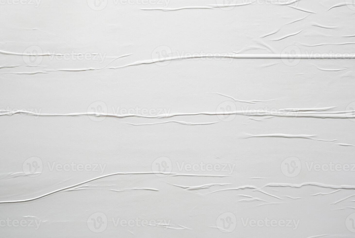 Minimalist white textured surface with soft horizontal lines and creases, ideal for abstract backgrounds, design, or texture use. photo