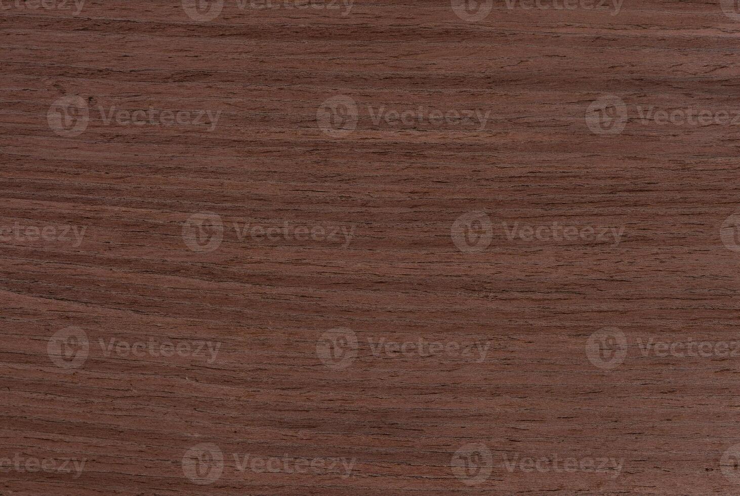 Close-up of dark brown wood texture with natural grain pattern, ideal for backgrounds or design purposes photo
