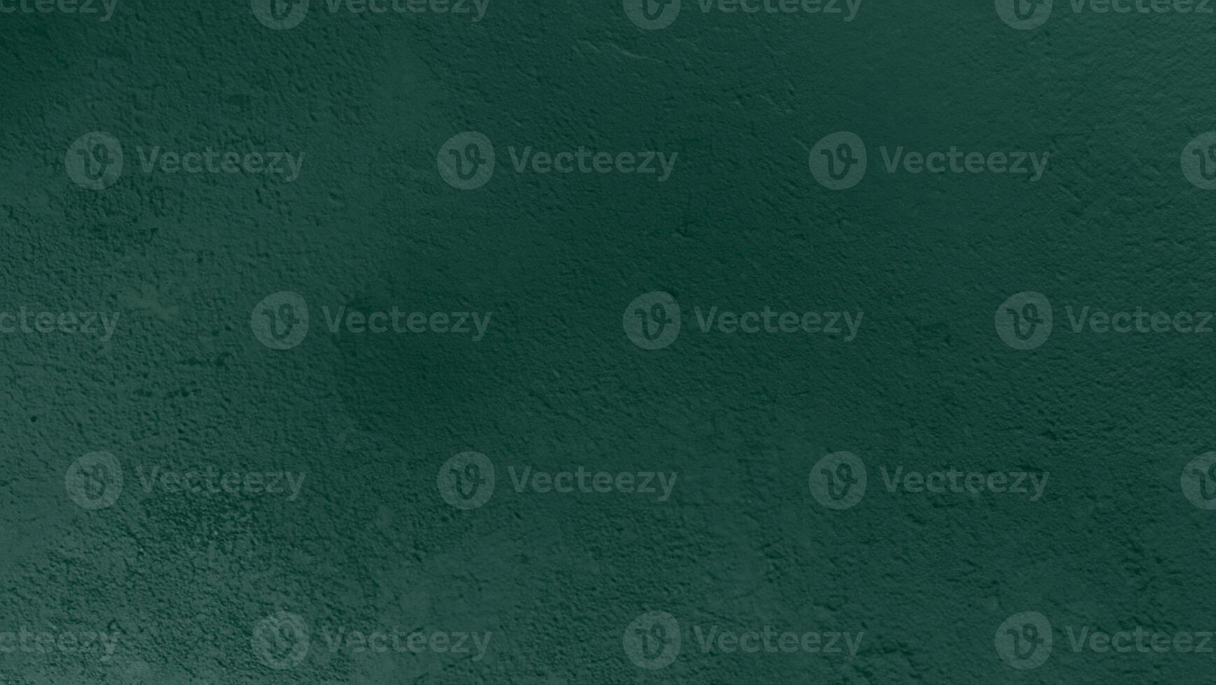 Dark green textured background with rough surface, suitable for design or text overlay. photo