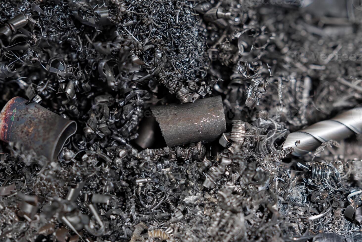 A detailed close-up of metal shavings and scrap from machining, showcasing intricate textures and industrial waste photo