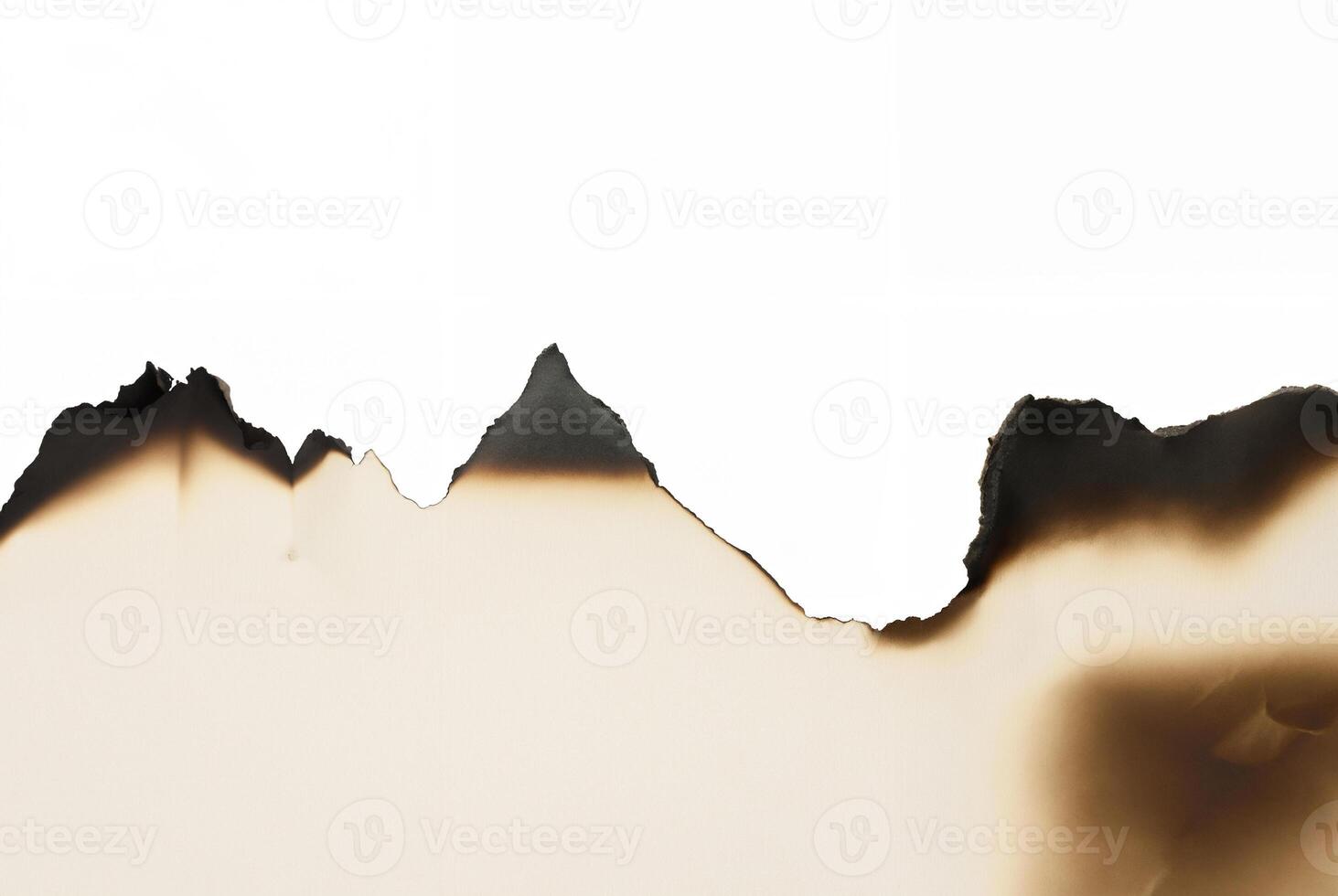 Burnt paper edge with jagged, torn, and scorched border isolated on white background, perfect for design. photo