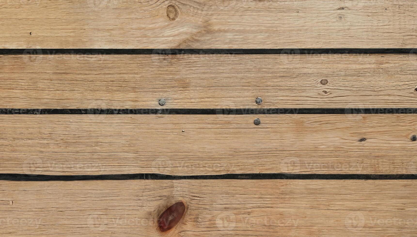 Close-up of wooden planks with dark grooves in a horizontal pattern, perfect for backgrounds, flooring, or architectural design. photo