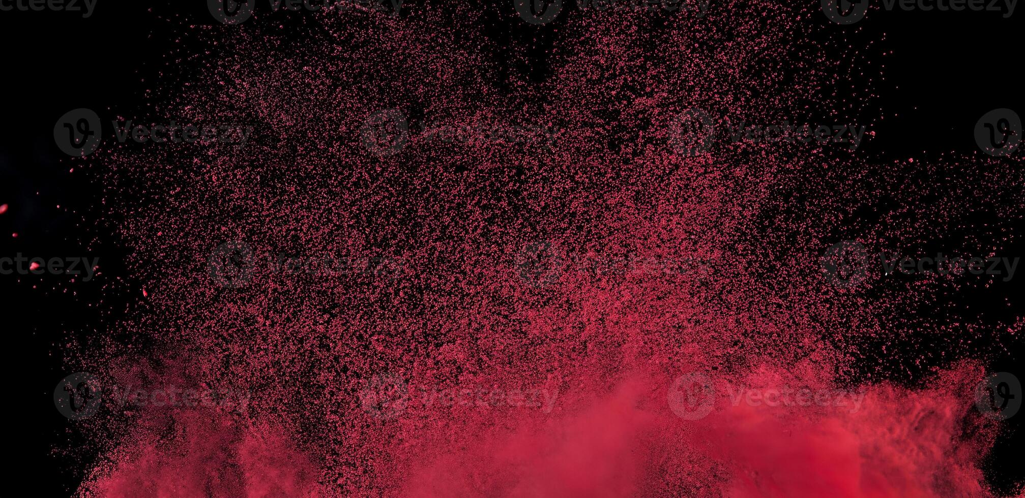 Close-up of abstract red powder explosion against a black background, ideal for creative or dynamic design projects. photo