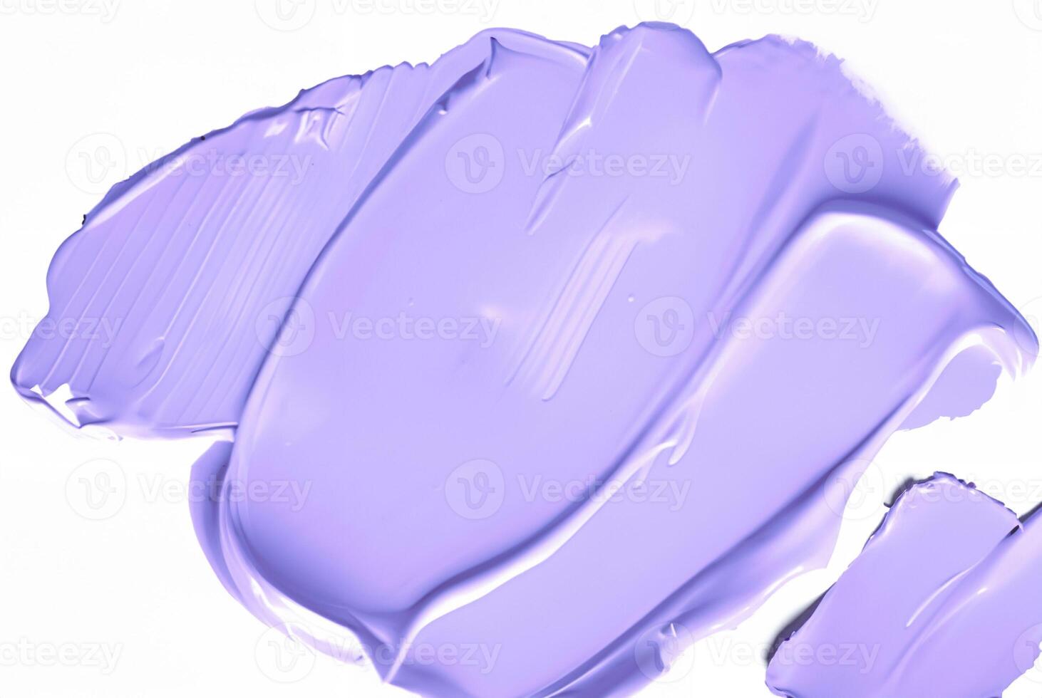 Close-up of a smooth purple smear of paint or cosmetic cream isolated on a white background, ideal for design or beauty-related concepts. photo