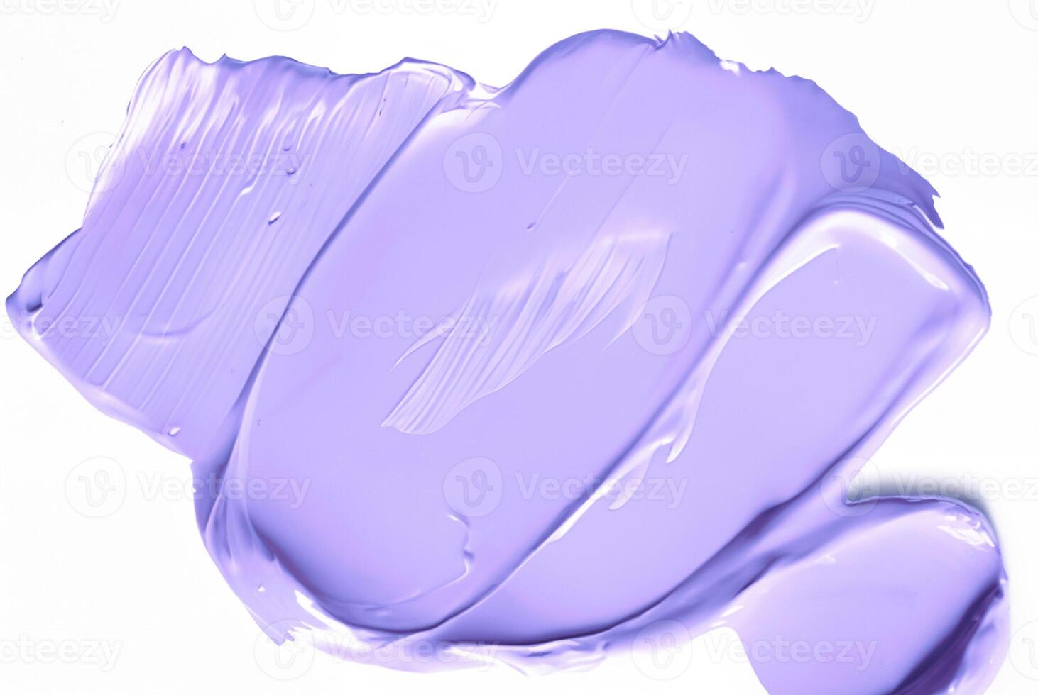 Close-up of a smooth purple smear of paint or cosmetic cream isolated on a white background, ideal for design or beauty-related concepts. photo