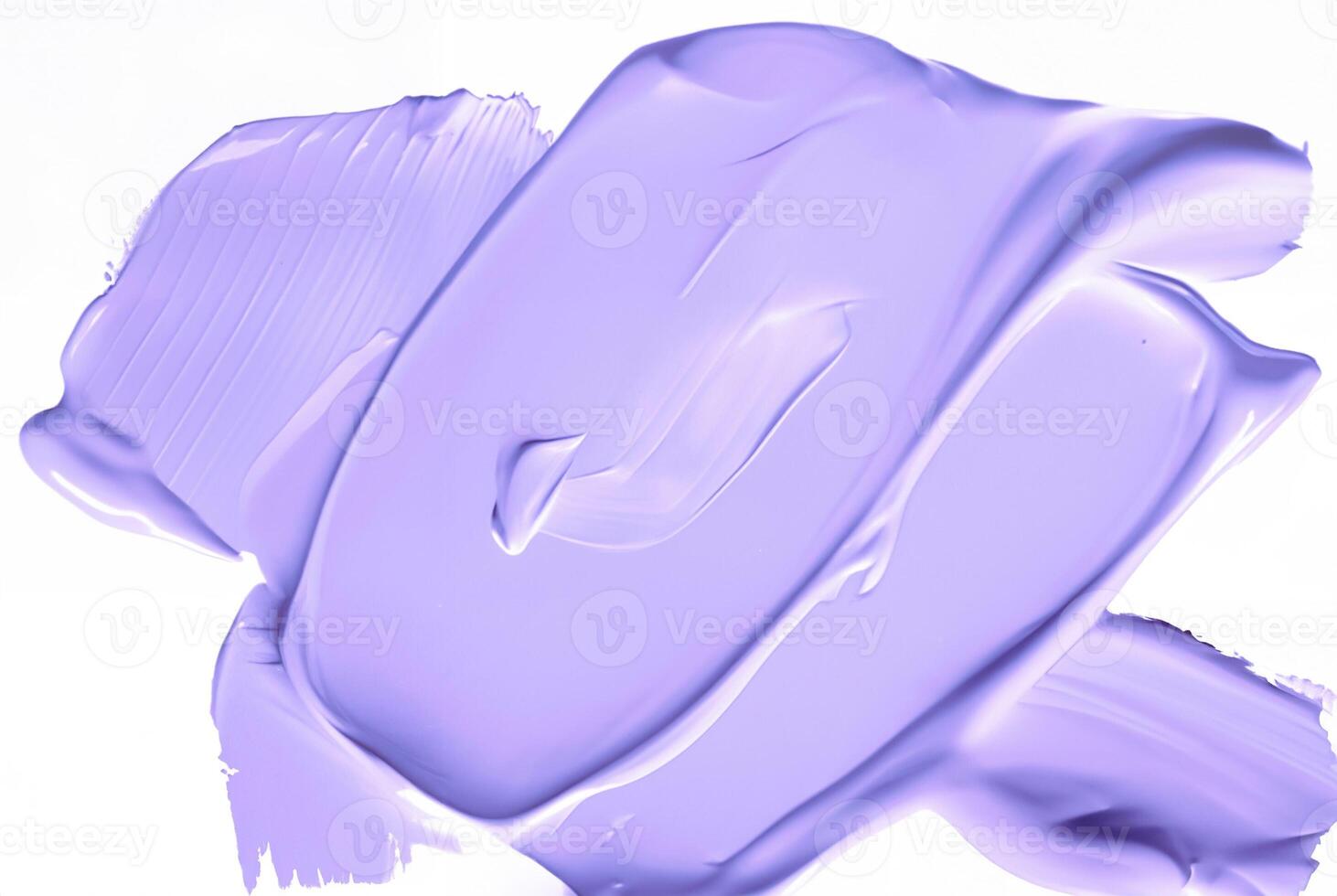 Close-up of a smooth purple smear of paint or cosmetic cream isolated on a white background, ideal for design or beauty-related concepts. photo