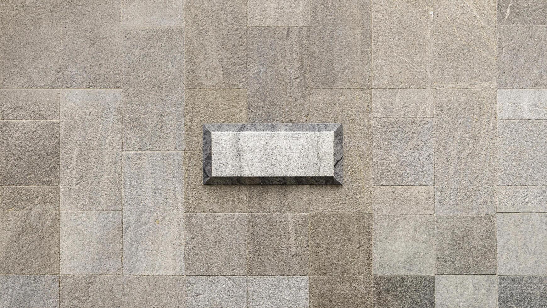 Close-up of light gray stone tile texture, ideal for use in flooring, wall surfaces, or as a background. photo