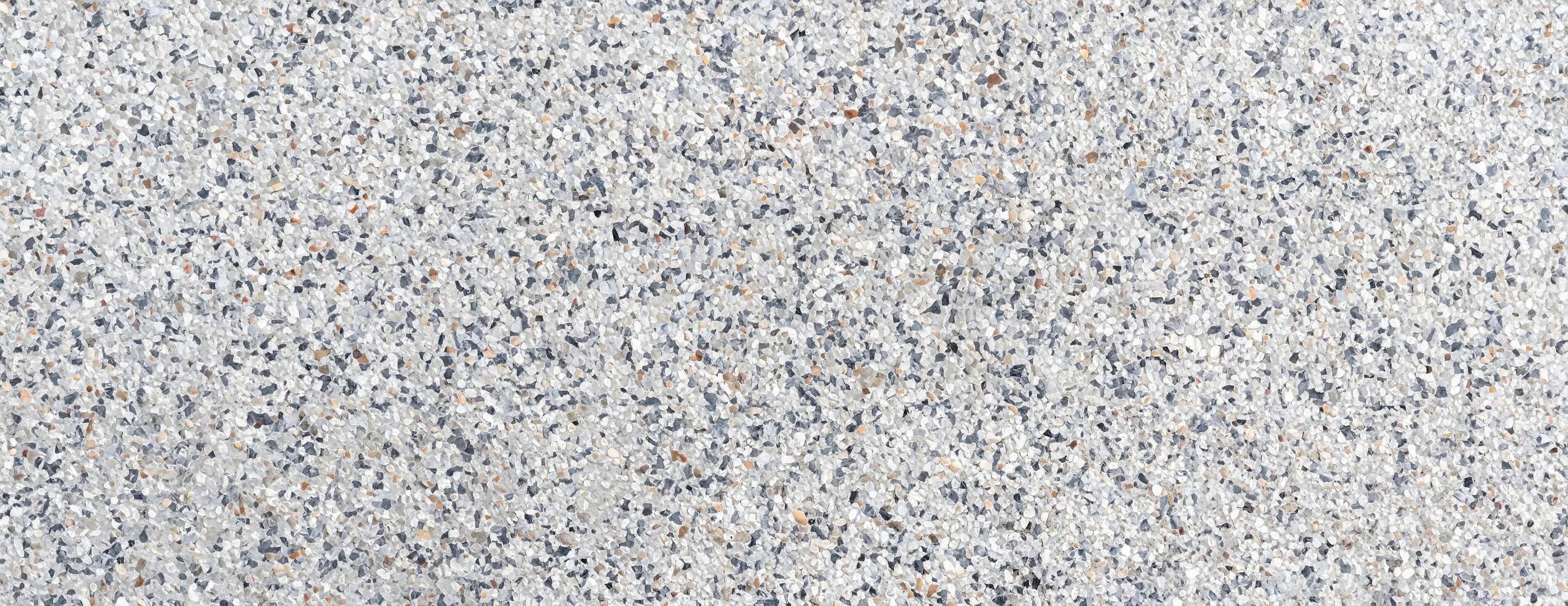 Close-up of terrazzo floor texture featuring mixed stone chips, ideal for architecture, flooring, and design projects photo
