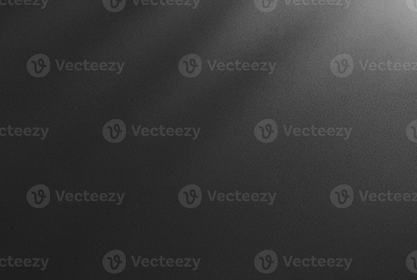 Abstract dark textured black background with a soft shadow gradient, ideal for backgrounds, designs, or overlay. photo
