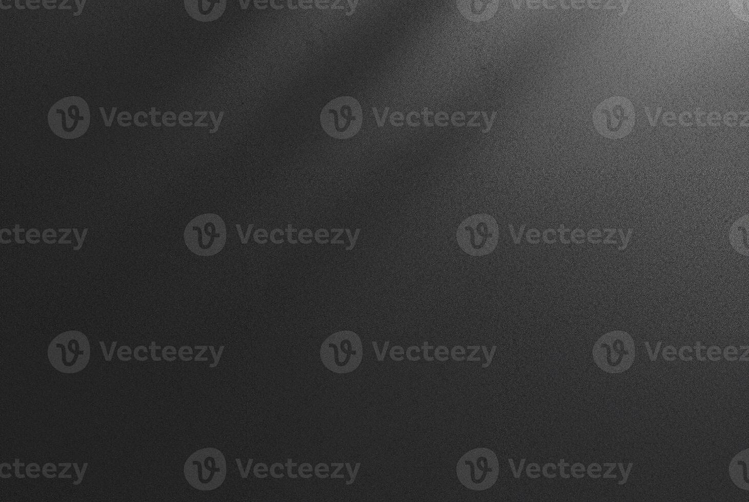 Abstract dark textured black background with a soft shadow gradient, ideal for backgrounds, designs, or overlay. photo