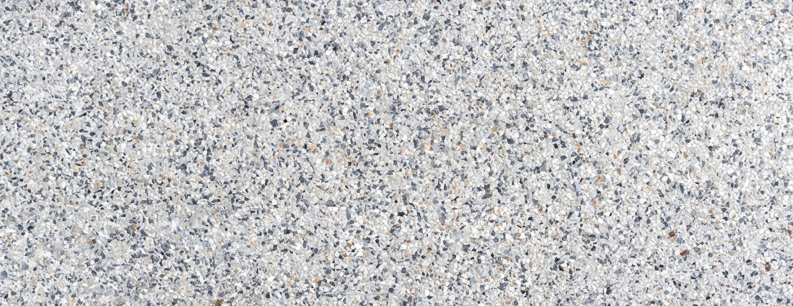 Close-up of terrazzo floor texture featuring mixed stone chips, ideal for architecture, flooring, and design projects photo
