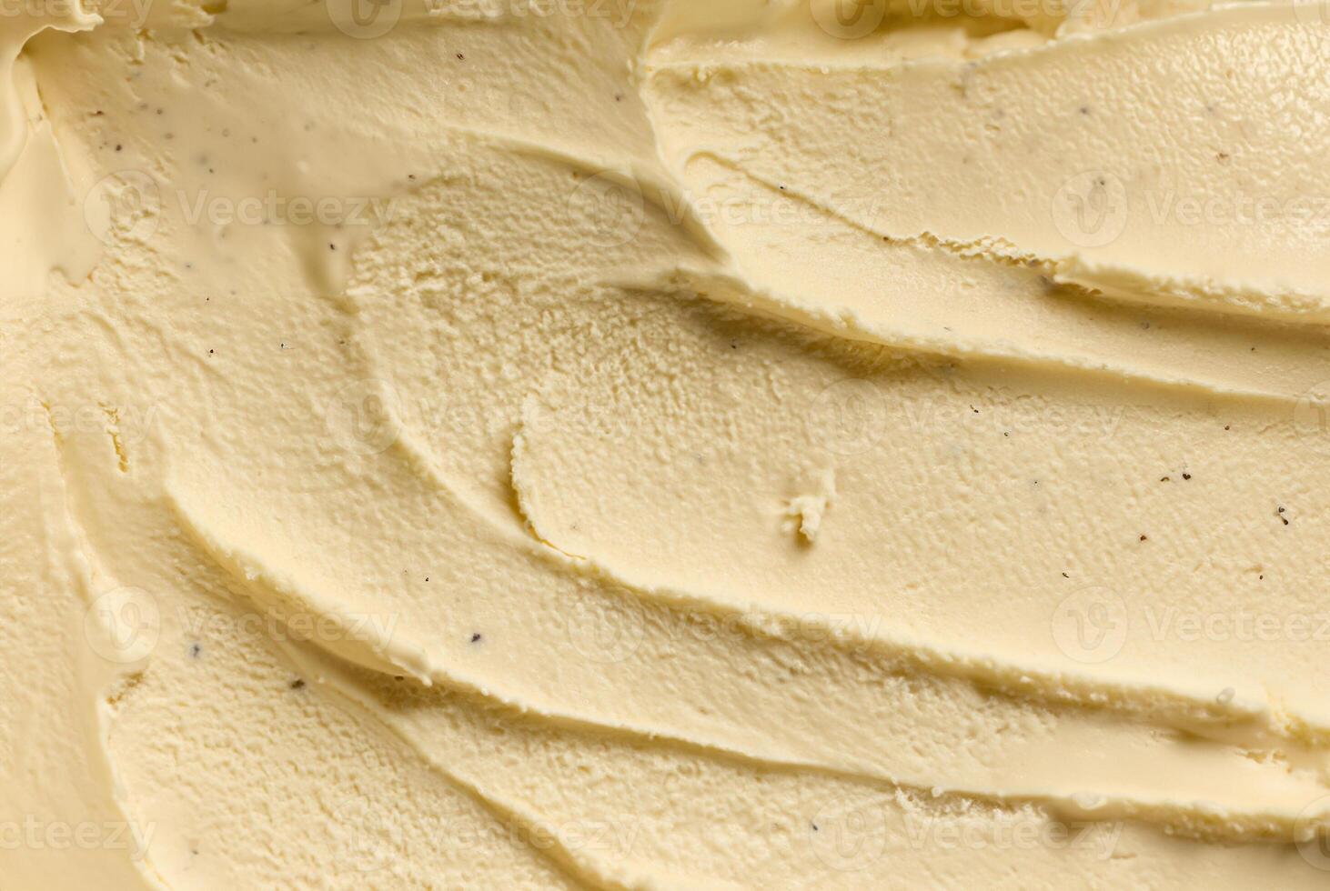Close-up of creamy vanilla ice cream texture with smooth swirls, showcasing rich and indulgent dessert photo