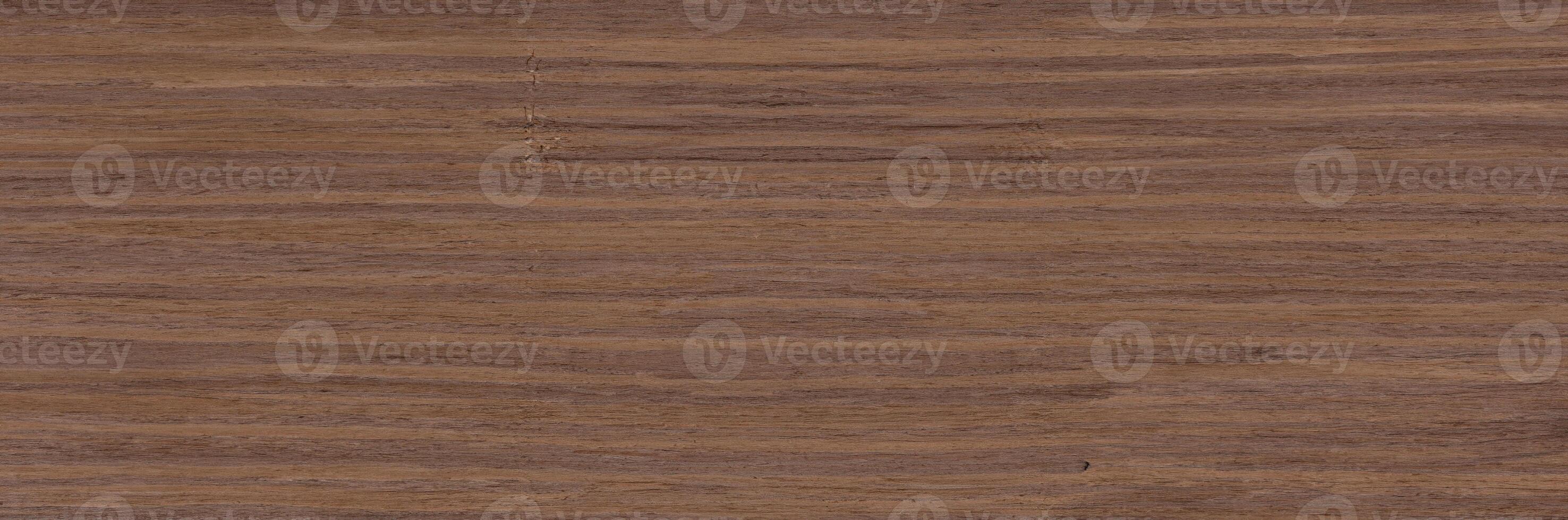 Close-up of natural wood grain texture in a brown color, ideal for backgrounds or design elements. photo
